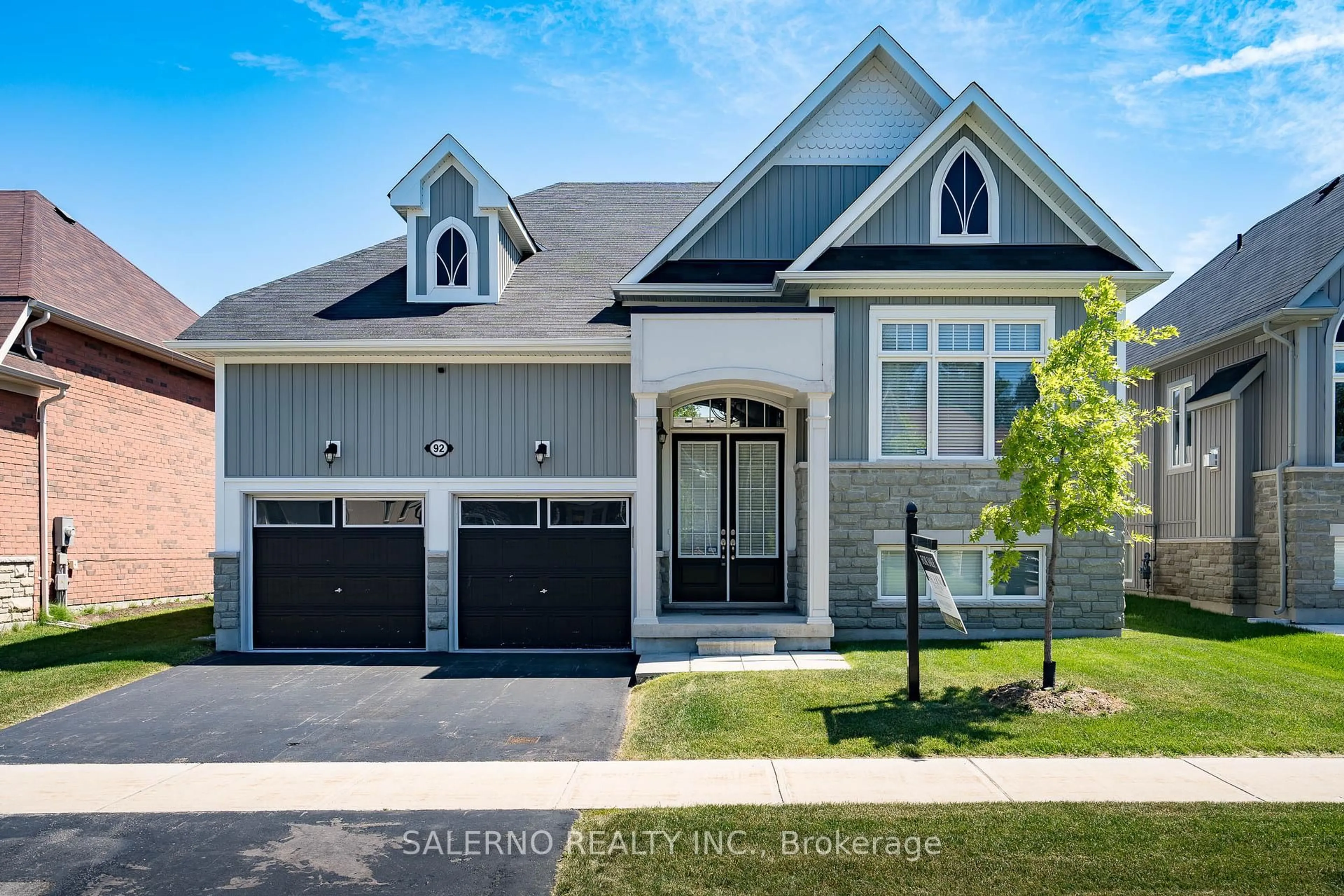 Home with brick exterior material, street for 92 Allegra Dr, Wasaga Beach Ontario L9Z 0H2