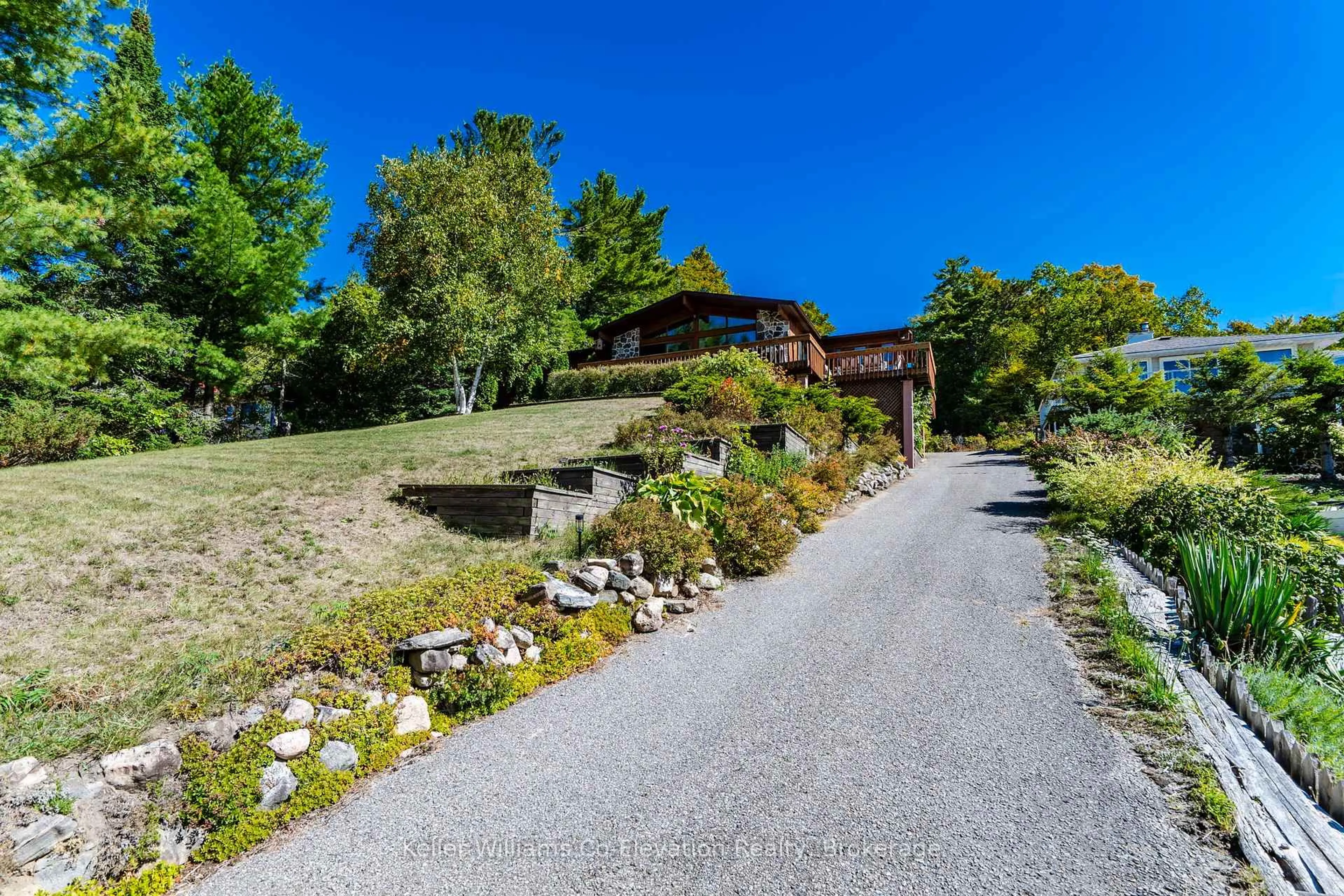 A pic from outside/outdoor area/front of a property/back of a property/a pic from drone, unknown for 43 Wendake Rd, Tiny Ontario L0L 2T0