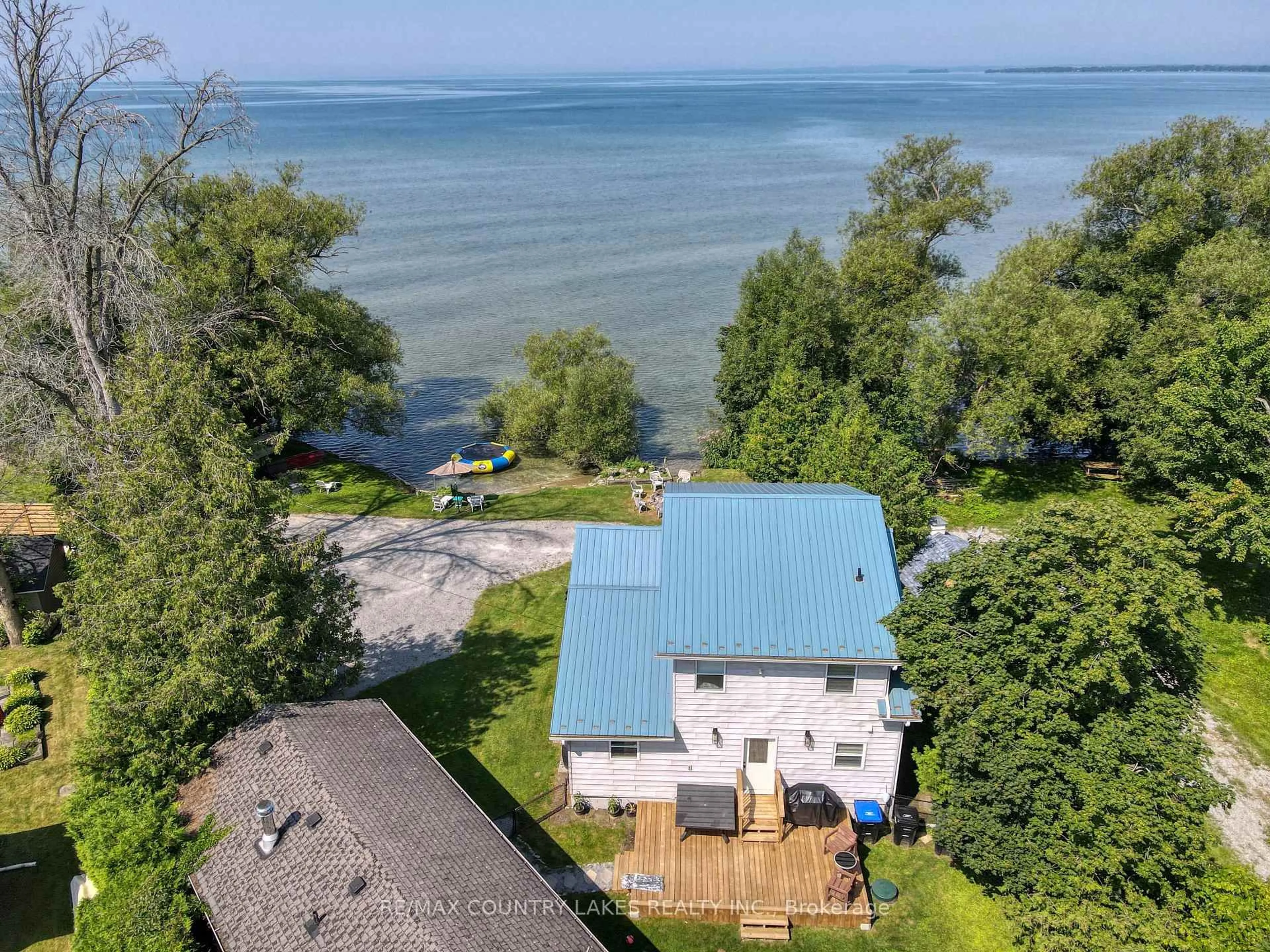 A pic from outside/outdoor area/front of a property/back of a property/a pic from drone, water/lake/river/ocean view for 104 The Steps Rd, Ramara Ontario L0K 1B0