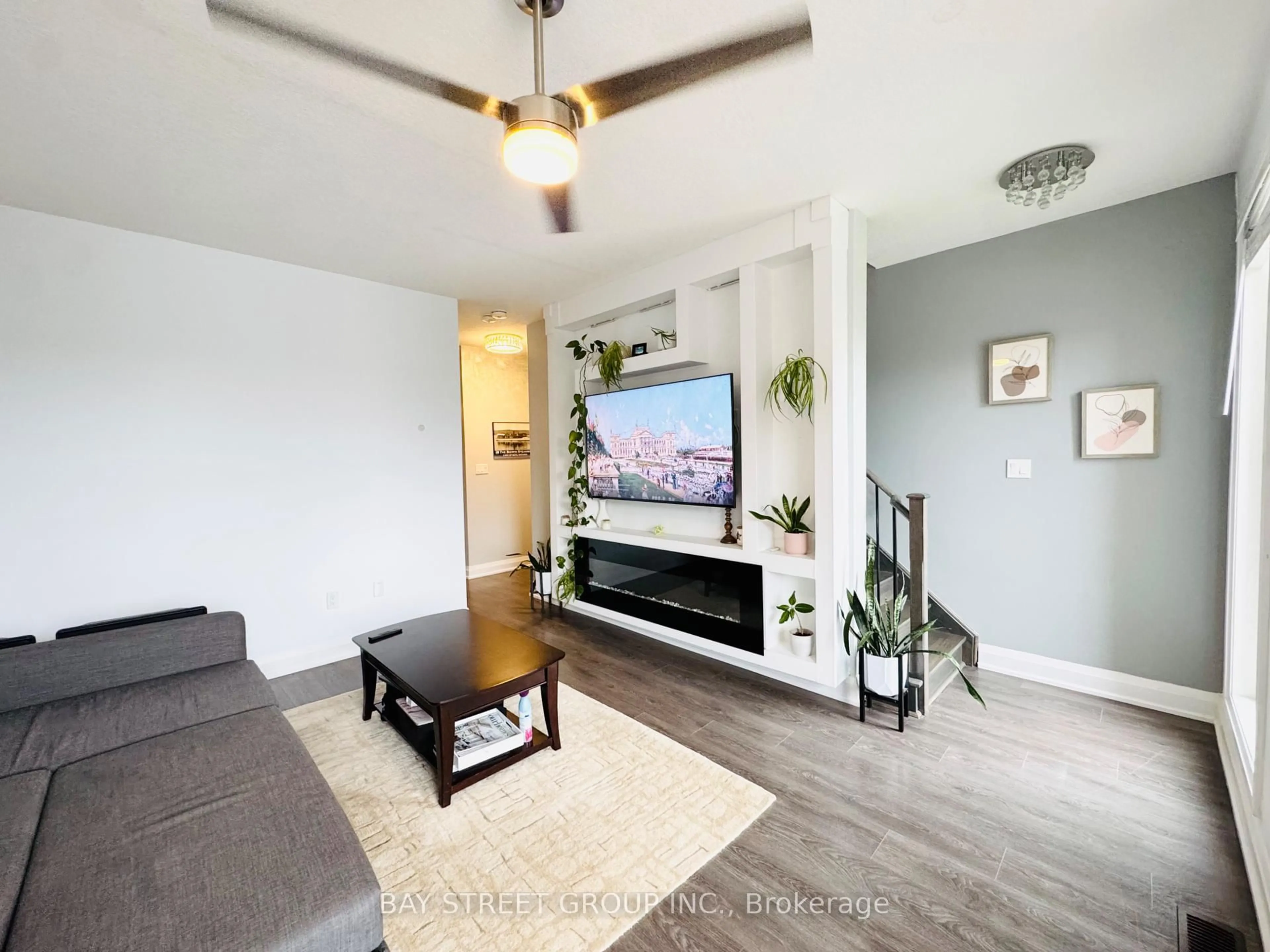 Living room with furniture, wood/laminate floor for 199 Ardagh Rd #26, Barrie Ontario L4N 3V5
