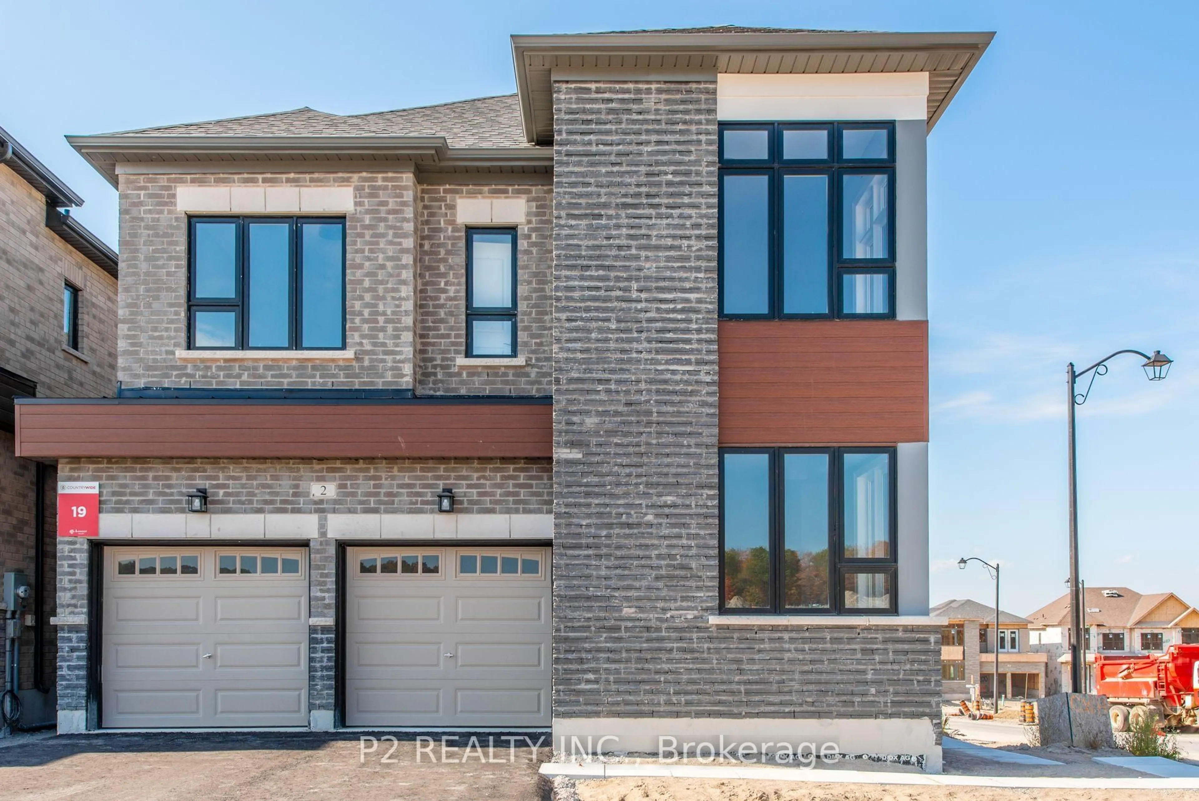 Home with brick exterior material, street for 2 Wild Ginger Lane, Springwater Ontario L9X 2C9
