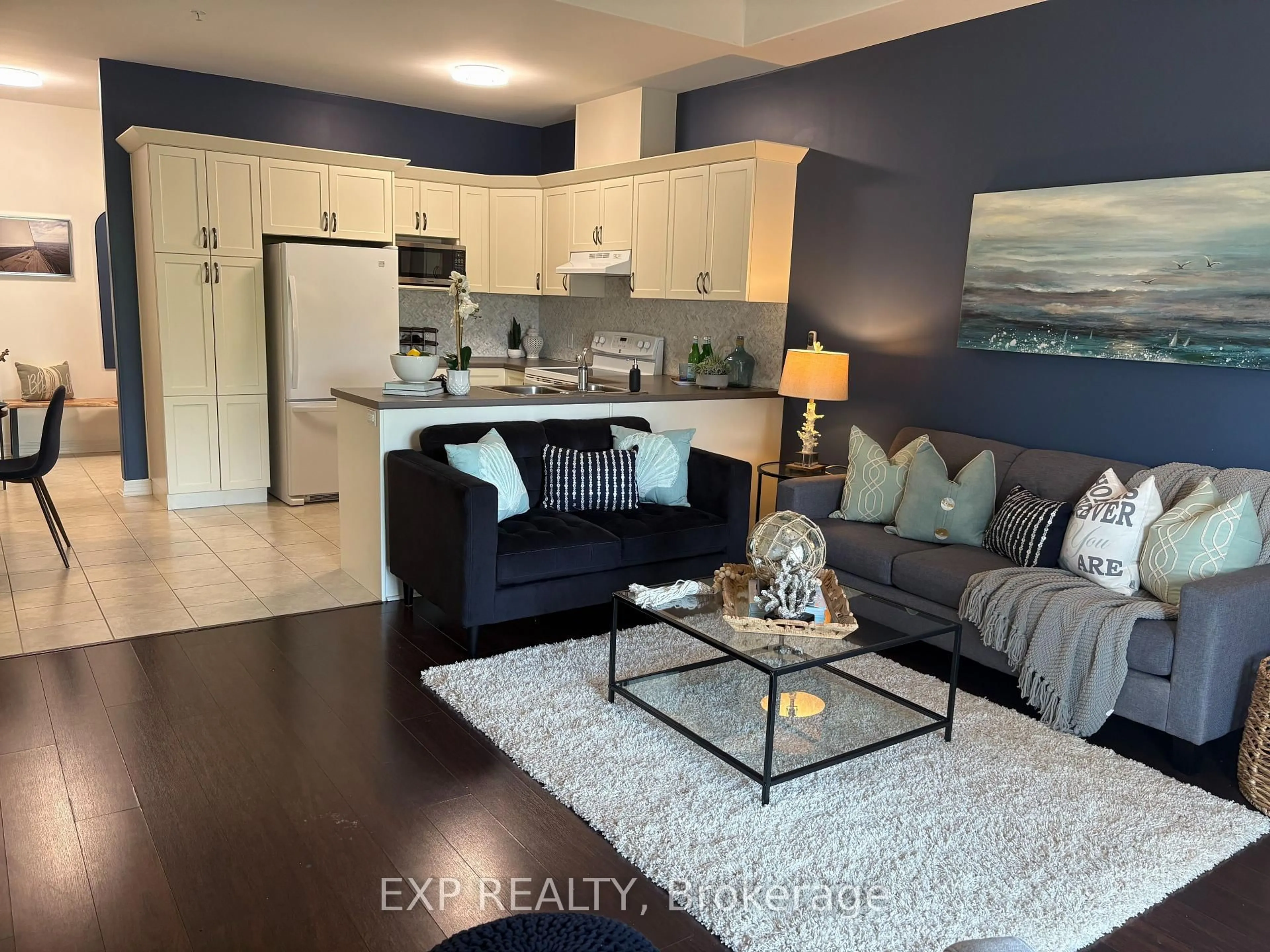 Open concept kitchen, wood/laminate floor for 1 Chamberlain Cres #102, Collingwood Ontario L9Y 0E3