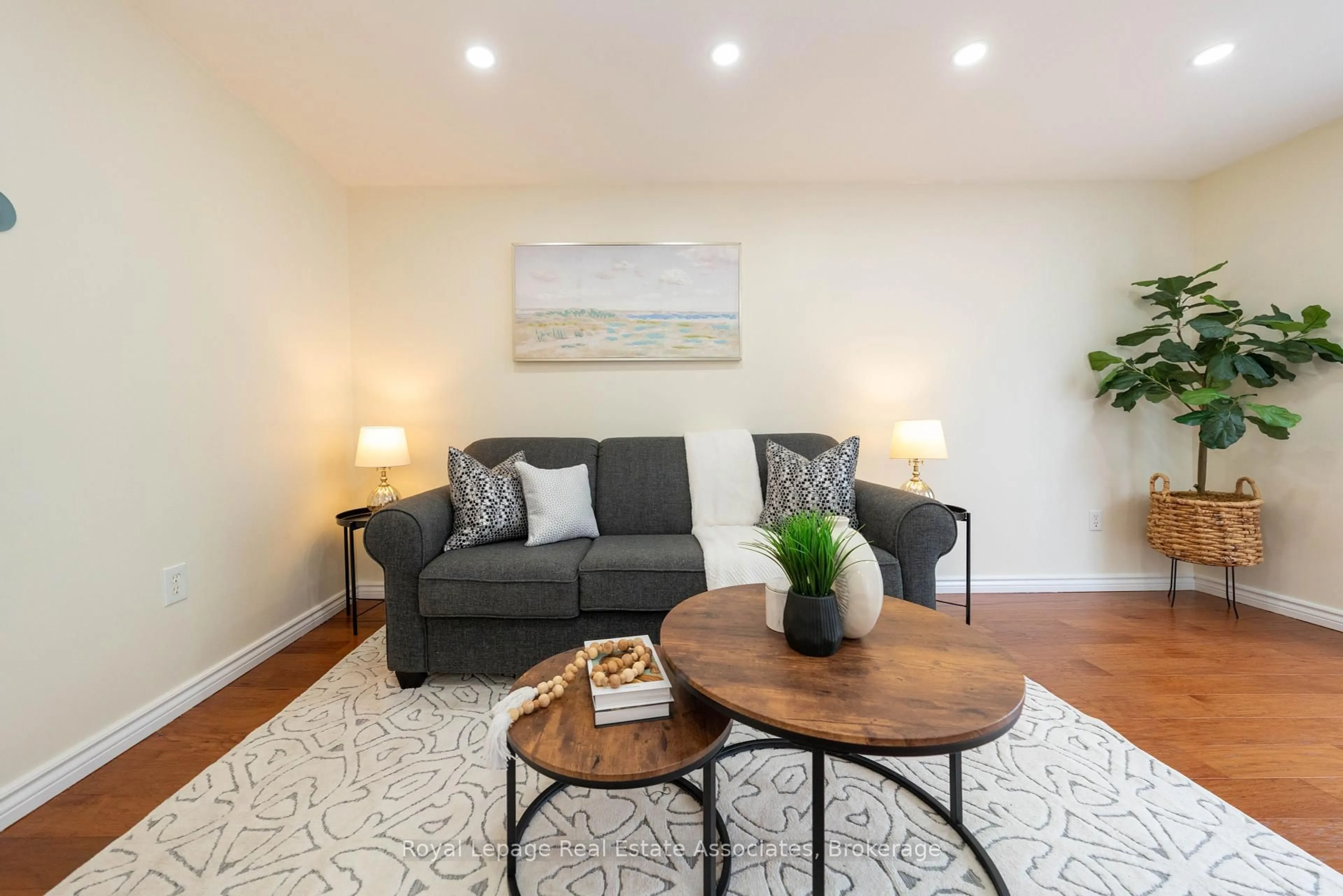Living room with furniture, wood/laminate floor for 41 Barrett Cres, Barrie Ontario L4N 5A4