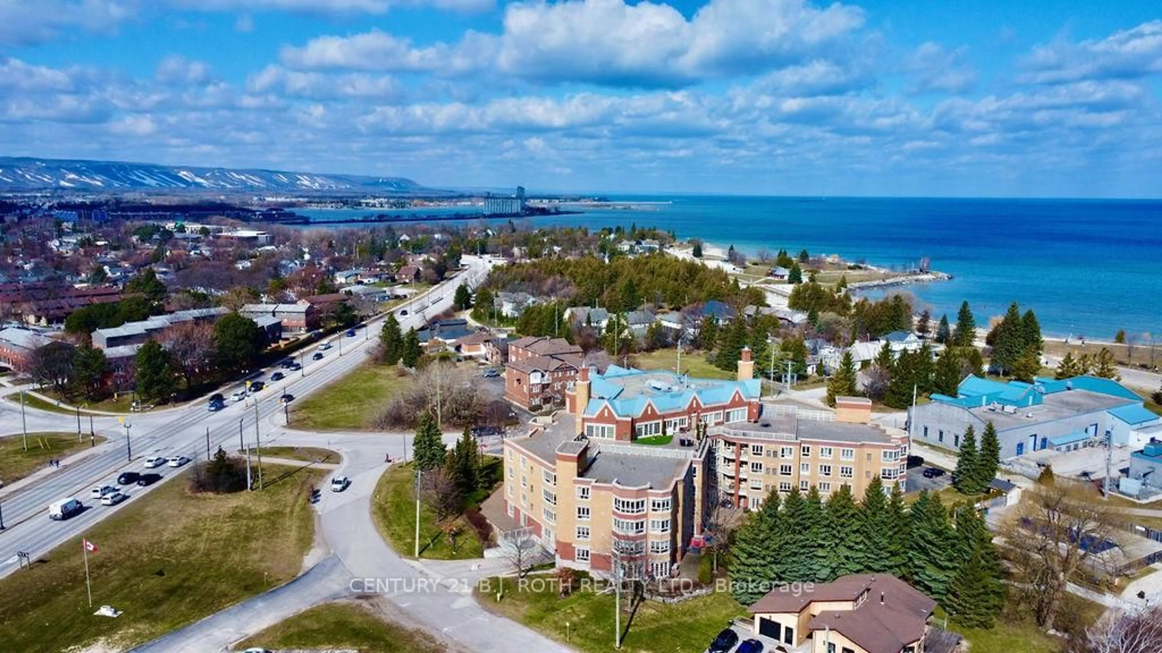 A pic from outside/outdoor area/front of a property/back of a property/a pic from drone, water/lake/river/ocean view for 16 Raglan St #304, Collingwood Ontario L9Y 4Y2