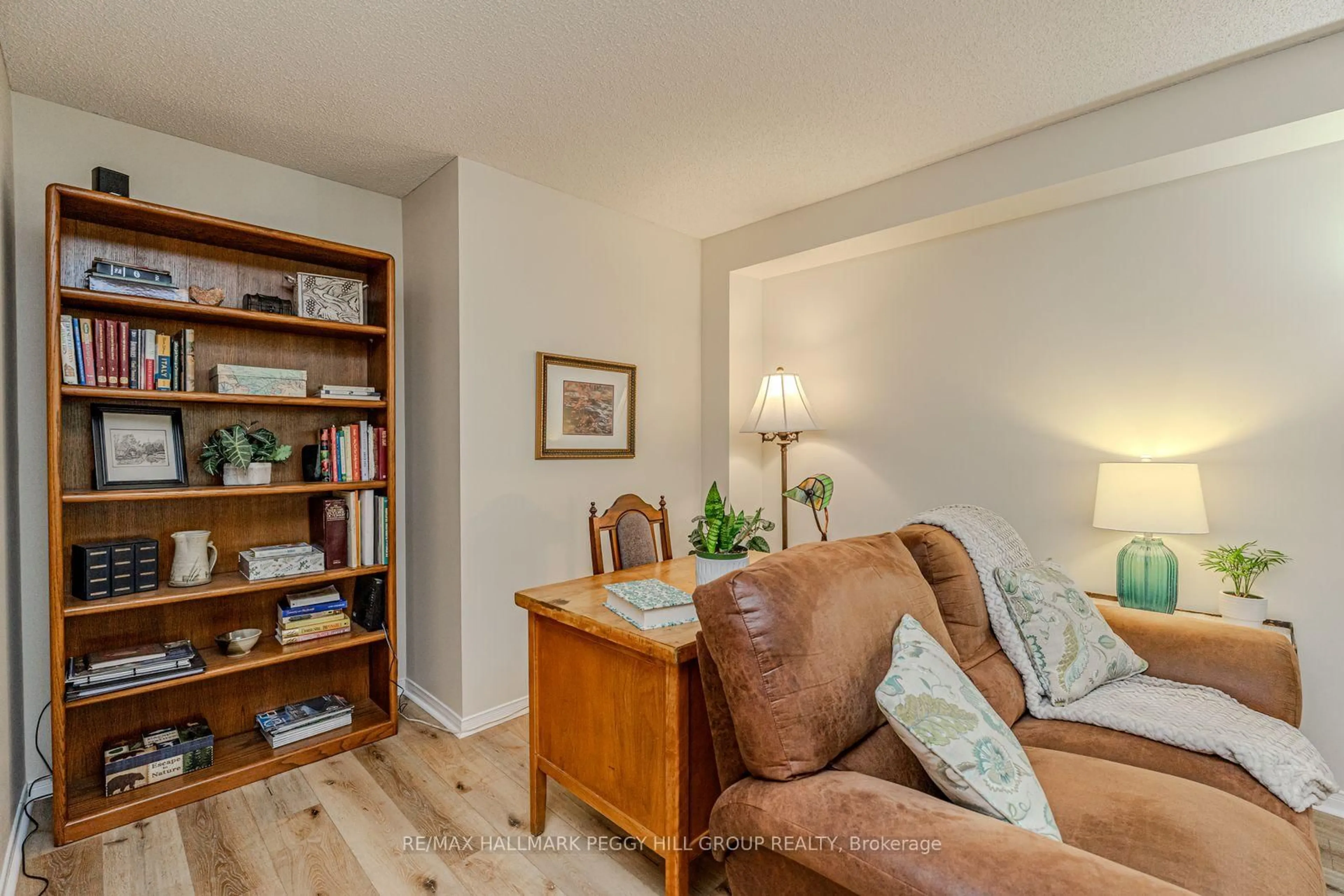 Living room with furniture, wood/laminate floor for 47 Finlay Rd, Barrie Ontario L4N 7T7