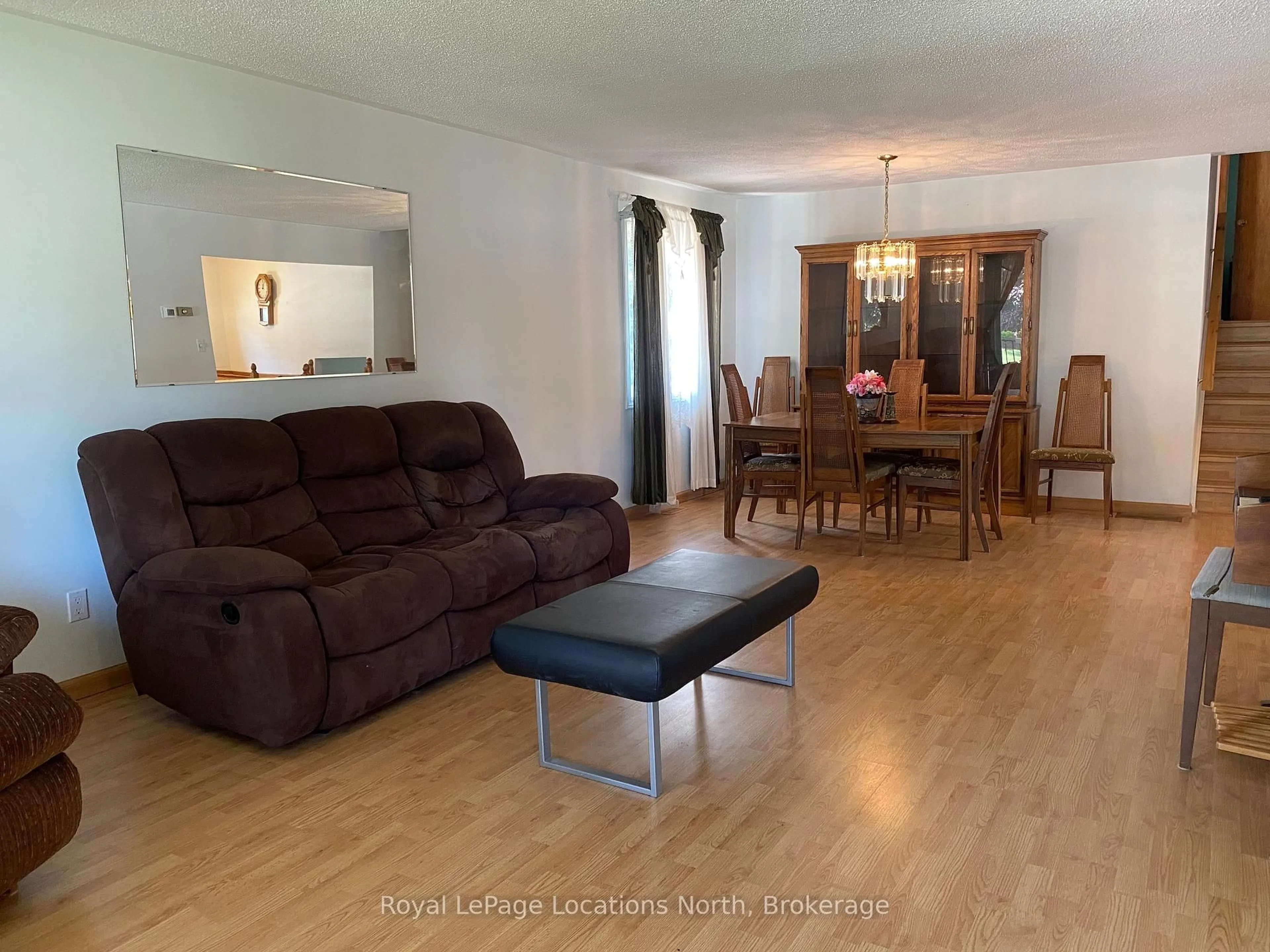 Living room with furniture, wood/laminate floor for 221 John St, Clearview Ontario L0M 1S0