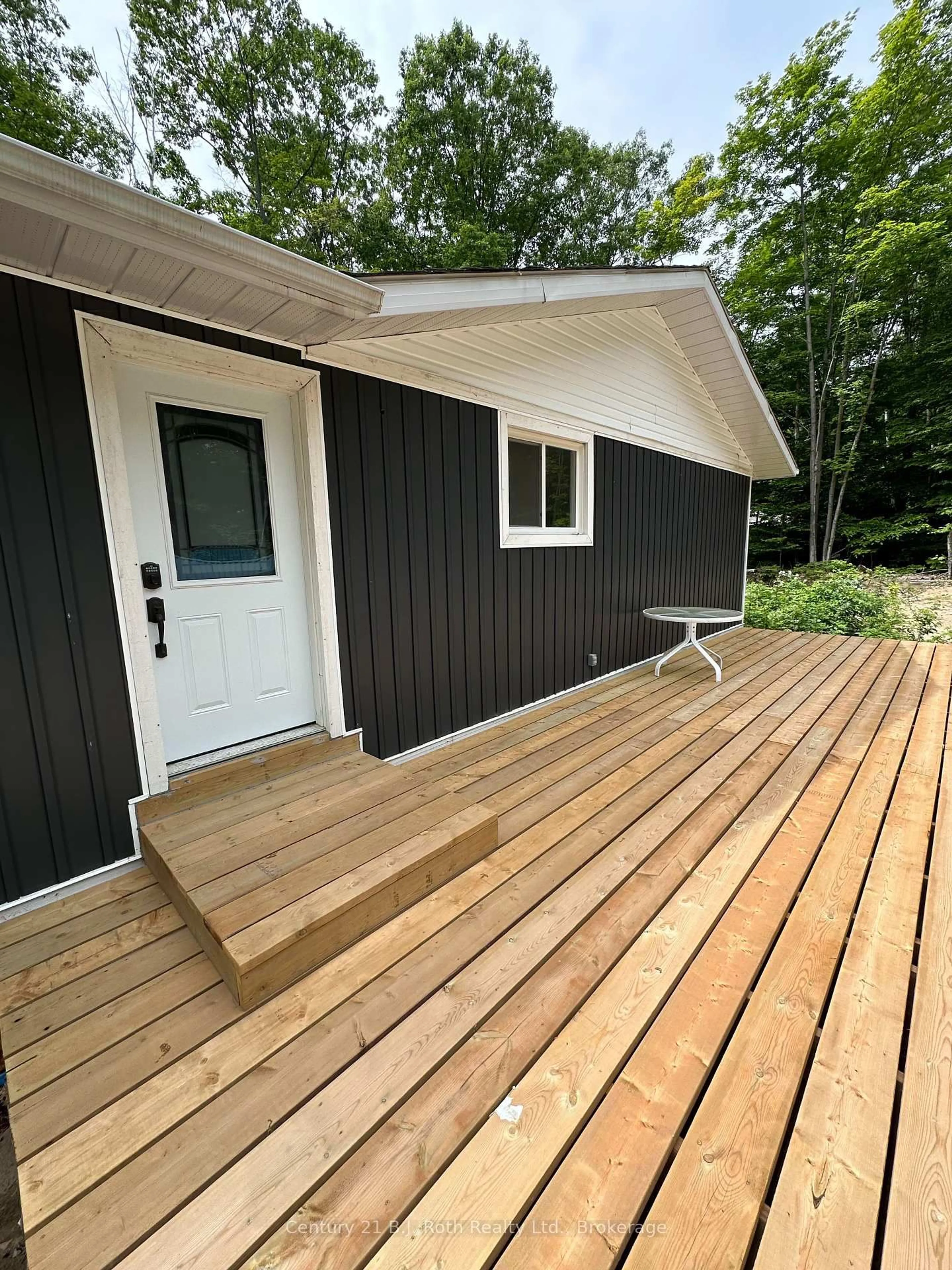 Home with vinyl exterior material, street for 1 Waagosh Miikans Lane, Christian Island 30 Ontario L9M 0A9