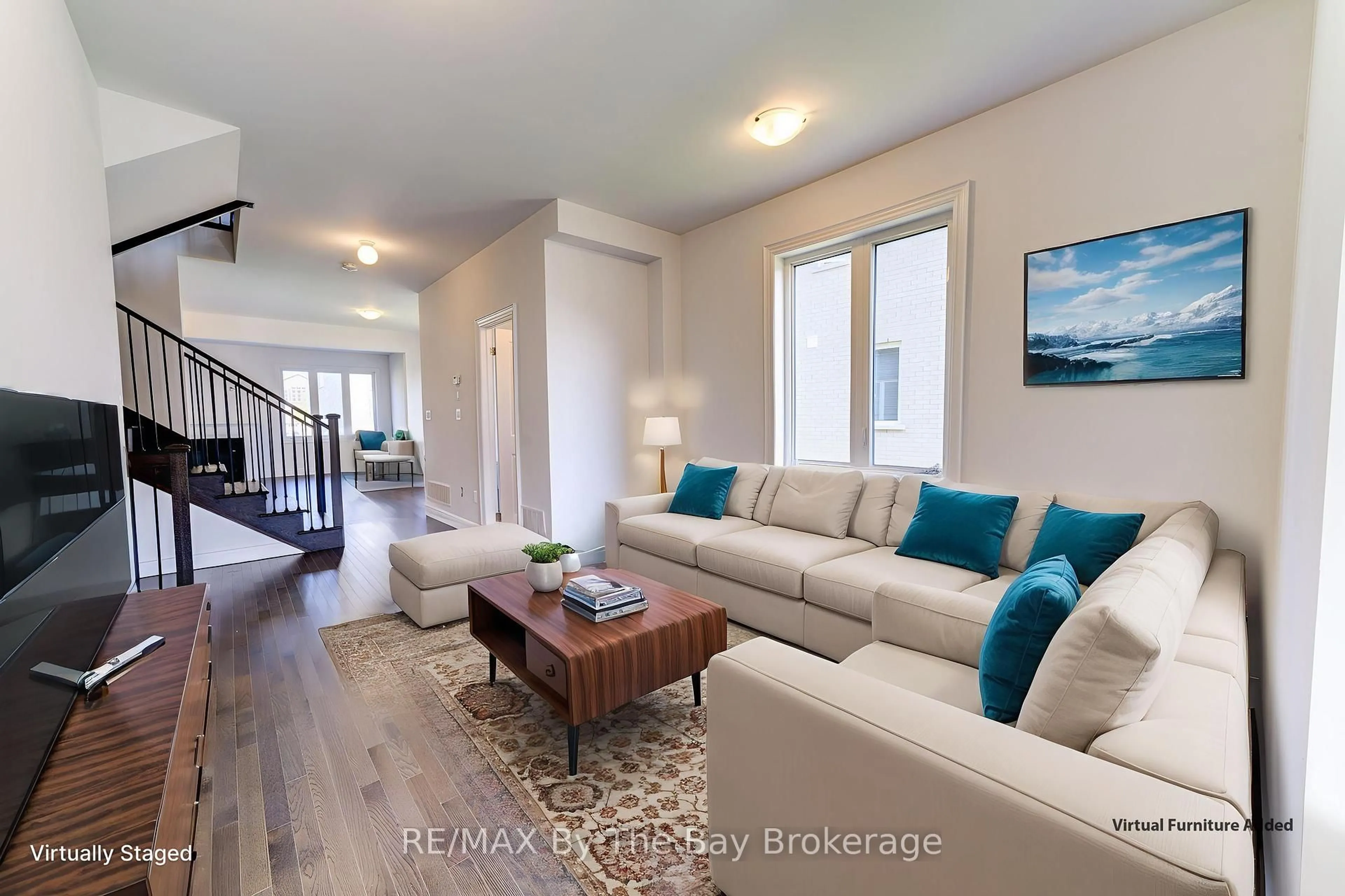 Living room with furniture, wood/laminate floor for 21 Lisa St, Wasaga Beach Ontario L9Z 1J9