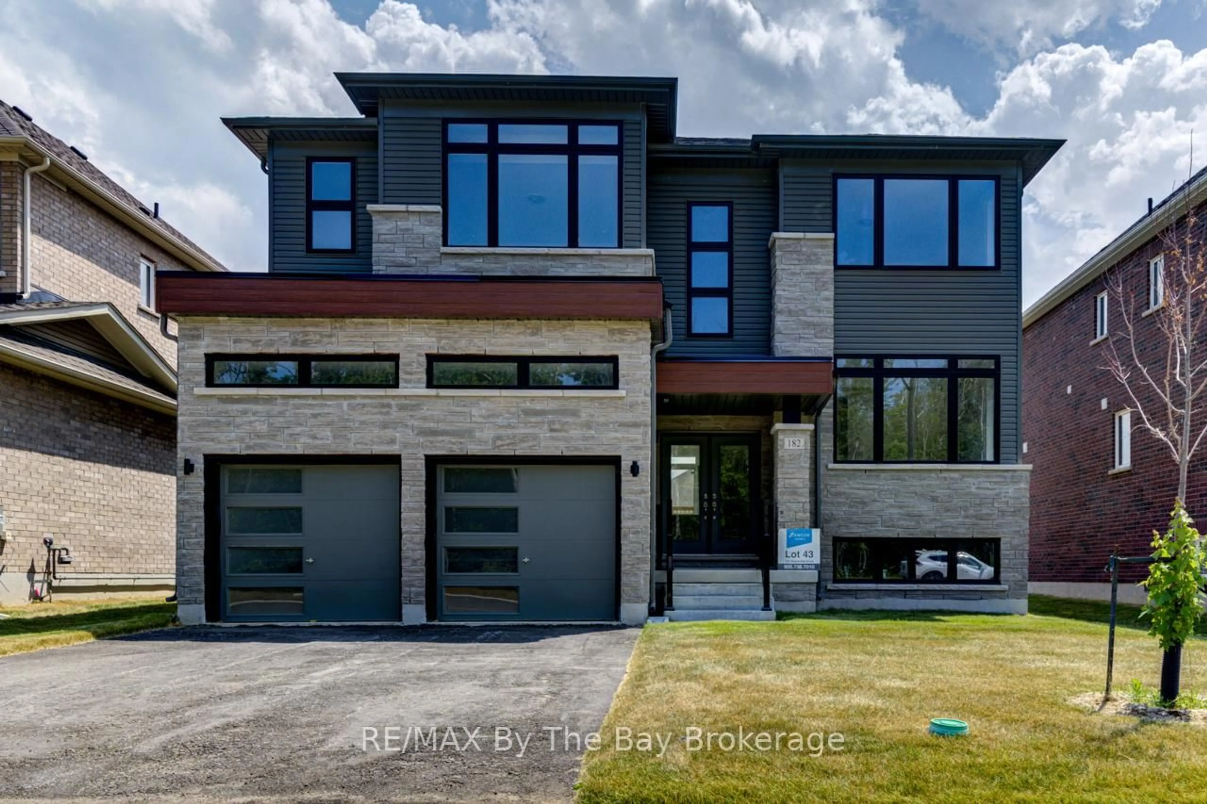 Home with brick exterior material, street for 182 Mapleside Dr, Wasaga Beach Ontario L9Z 0L4
