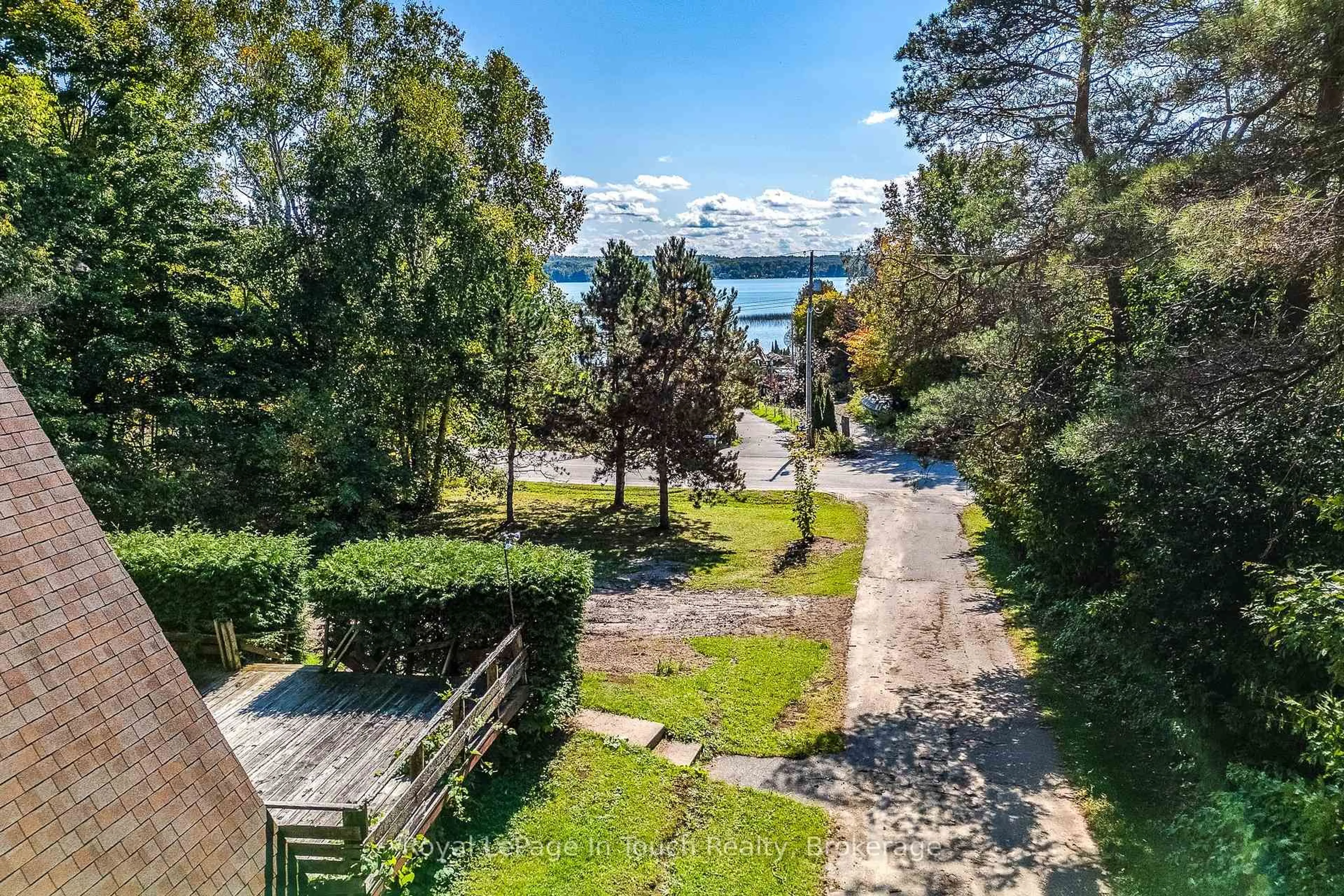 A pic from outside/outdoor area/front of a property/back of a property/a pic from drone, water/lake/river/ocean view for 2170 North Orr Lake Rd, Springwater Ontario L0L 1P0