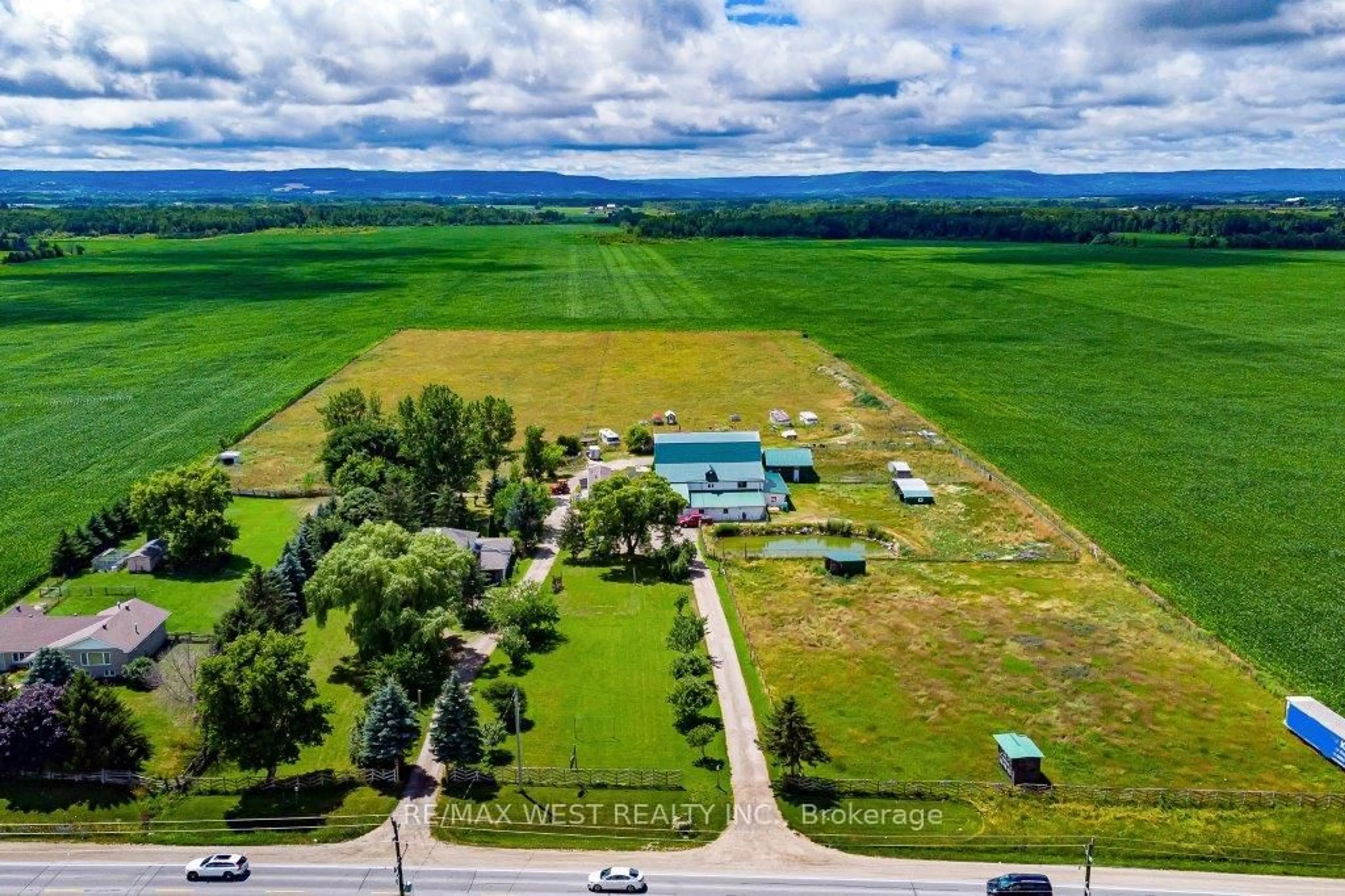 A pic from outside/outdoor area/front of a property/back of a property/a pic from drone, mountain view for 7941 Highway 26, Clearview Ontario L0M 1S0