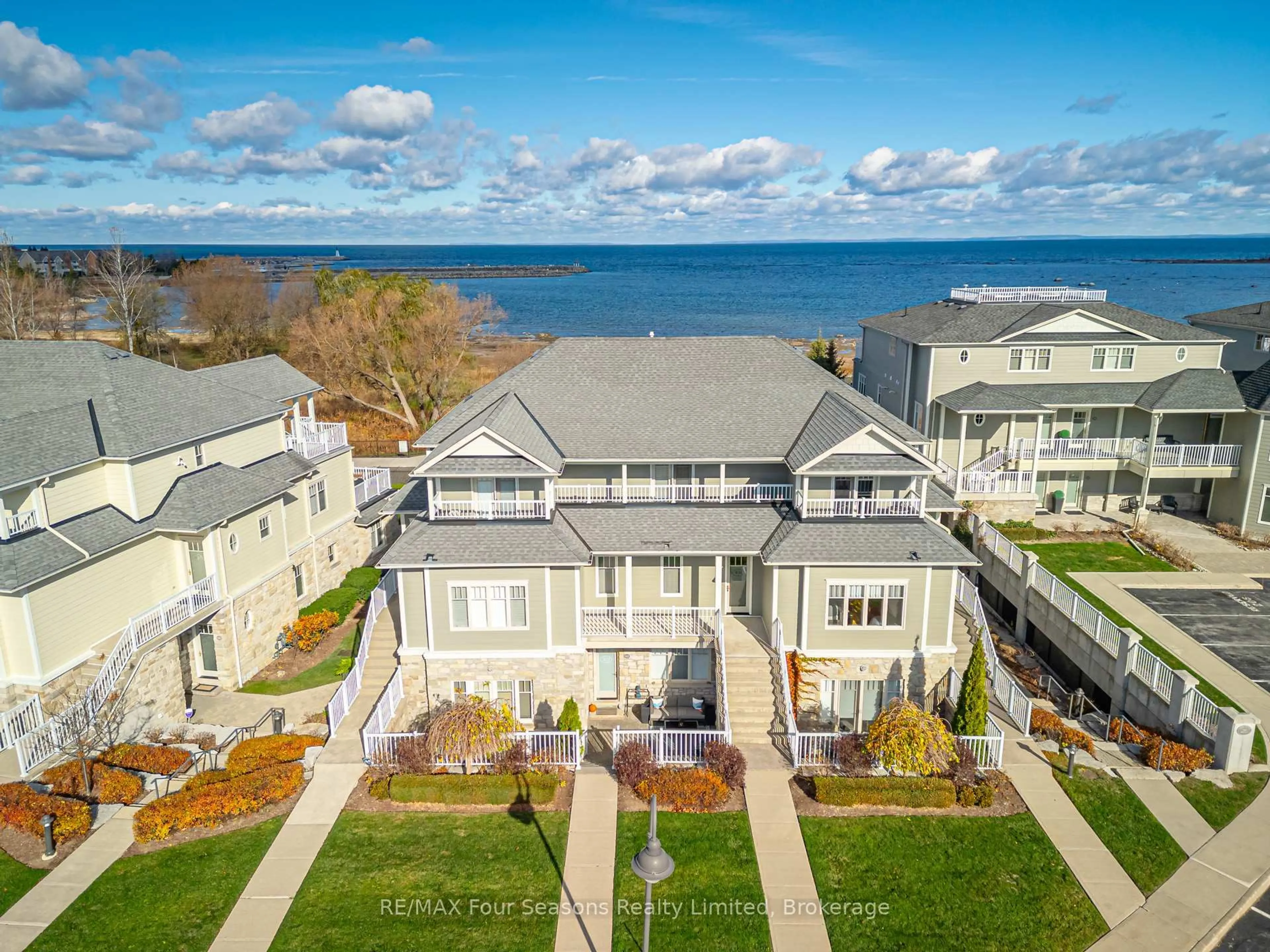 A pic from outside/outdoor area/front of a property/back of a property/a pic from drone, water/lake/river/ocean view for 40 Trott Blvd #306, Collingwood Ontario L9Y 5K5