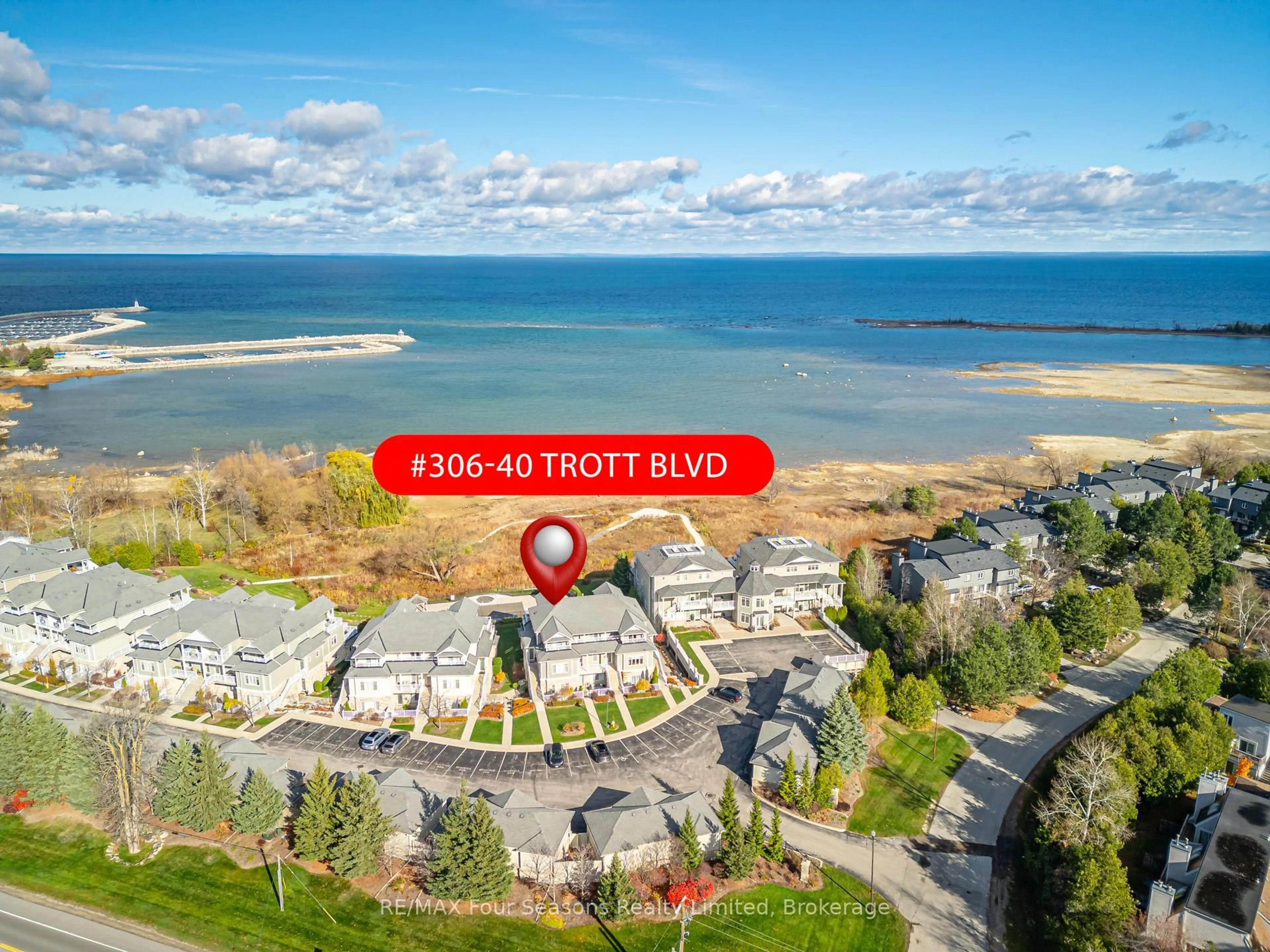 A pic from outside/outdoor area/front of a property/back of a property/a pic from drone, water/lake/river/ocean view for 40 Trott Blvd #306, Collingwood Ontario L9Y 5K5