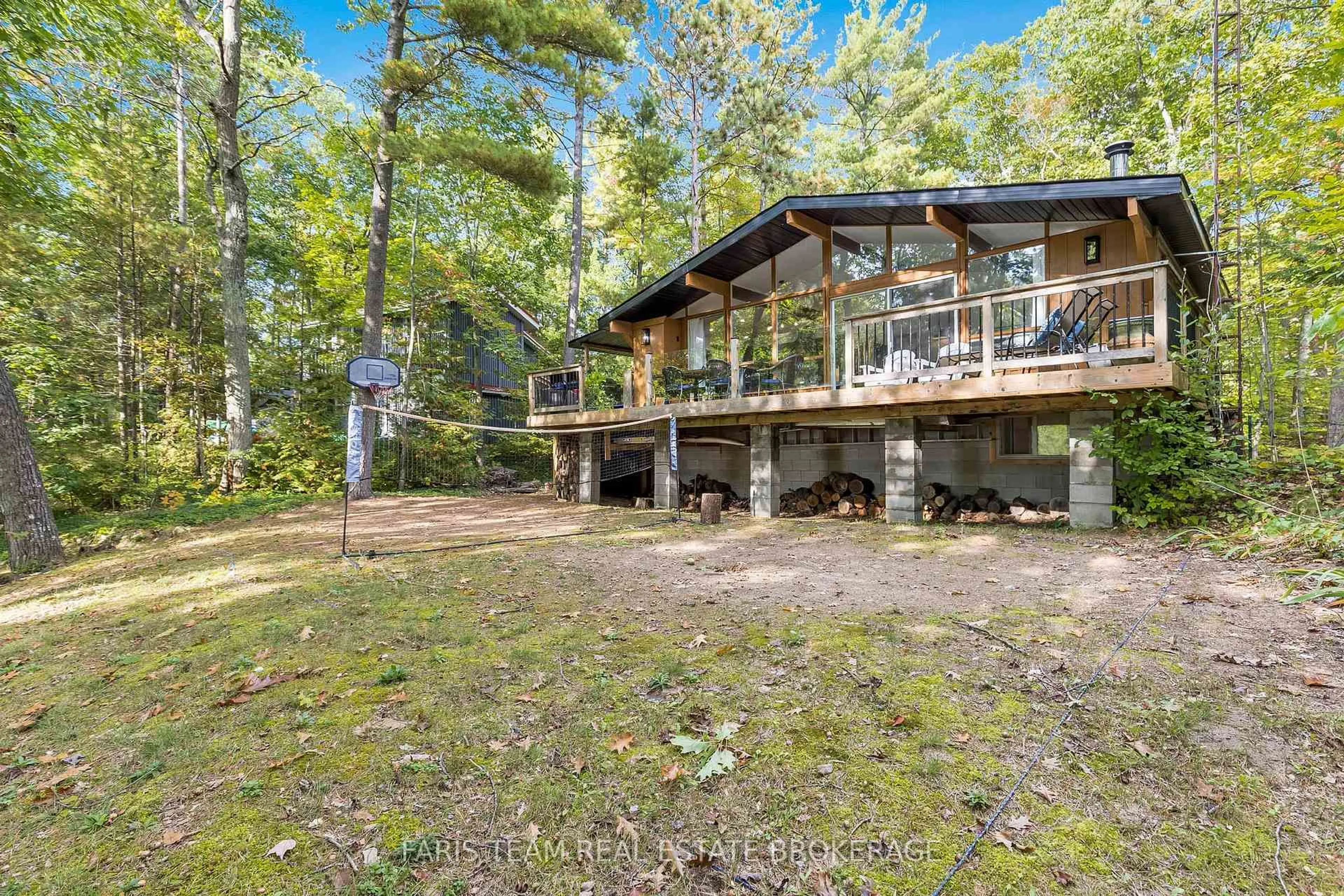 A pic from outside/outdoor area/front of a property/back of a property/a pic from drone, forest/trees view for 1292 Tiny Beaches Rd, Tiny Ontario L9M 0H3