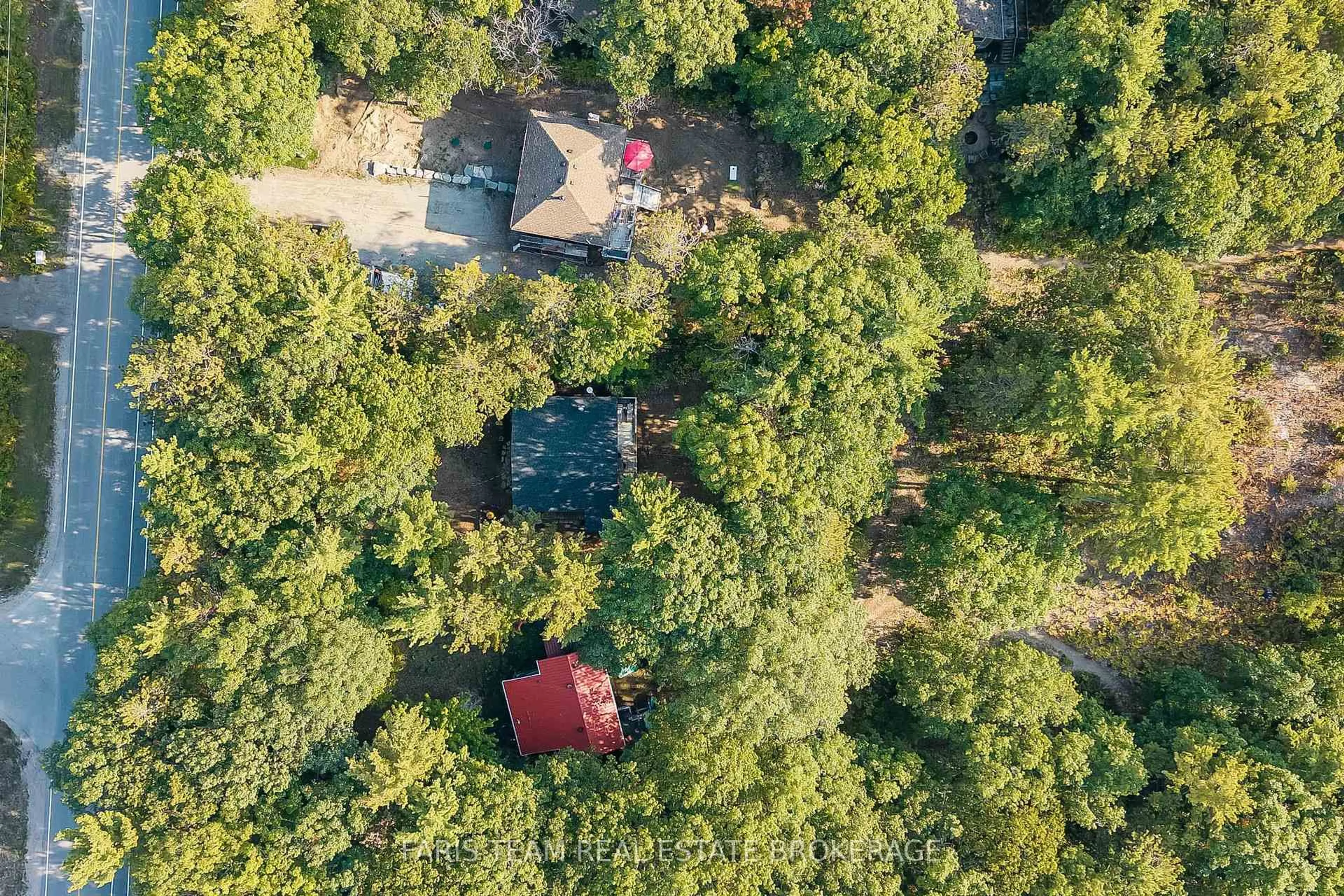 A pic from outside/outdoor area/front of a property/back of a property/a pic from drone, forest/trees view for 1292 Tiny Beaches Rd, Tiny Ontario L9M 0H3