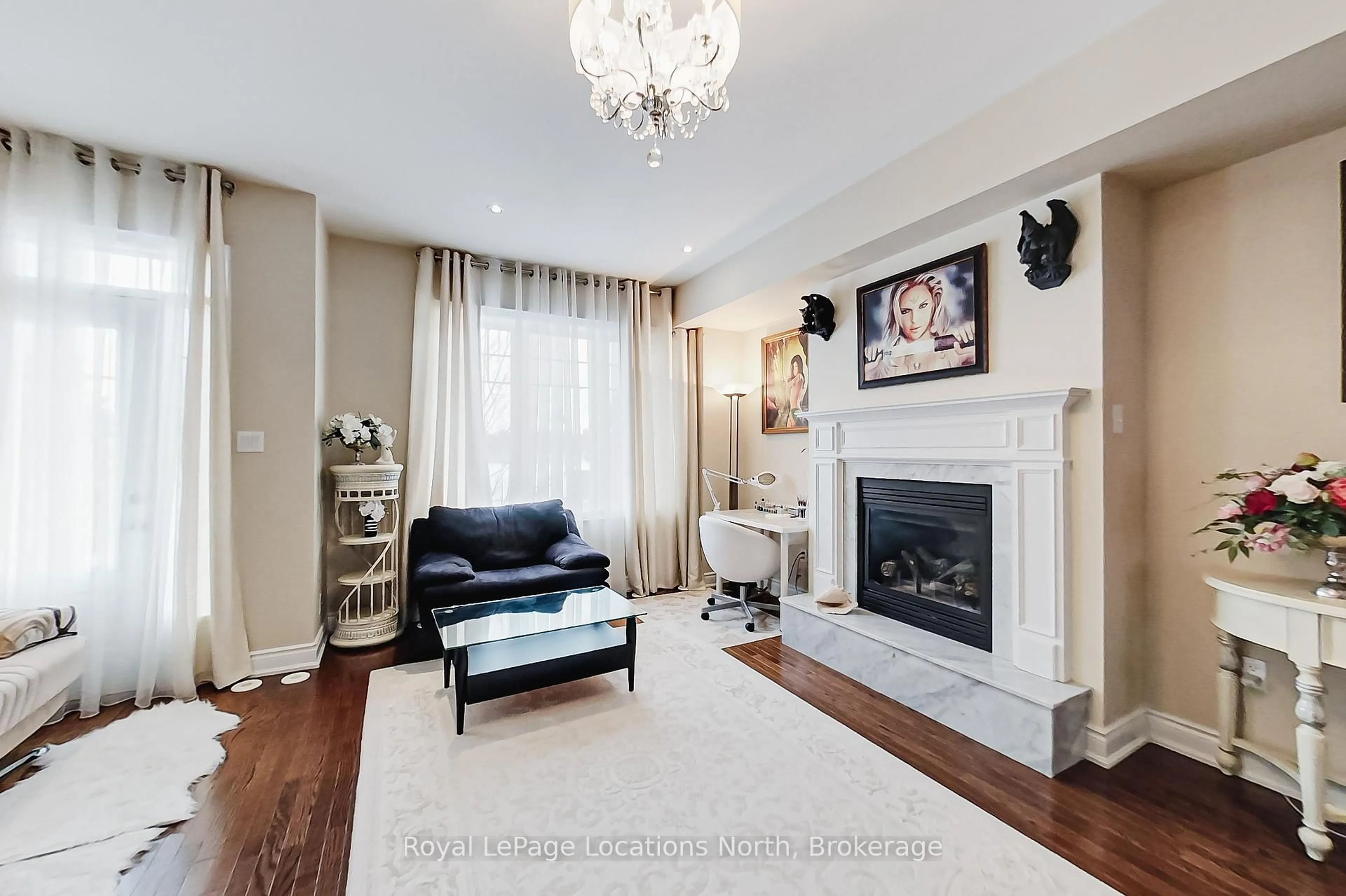 Living room with furniture, wood/laminate floor for 11 WALLY Dr, Wasaga Beach Ontario L9Z 0E4