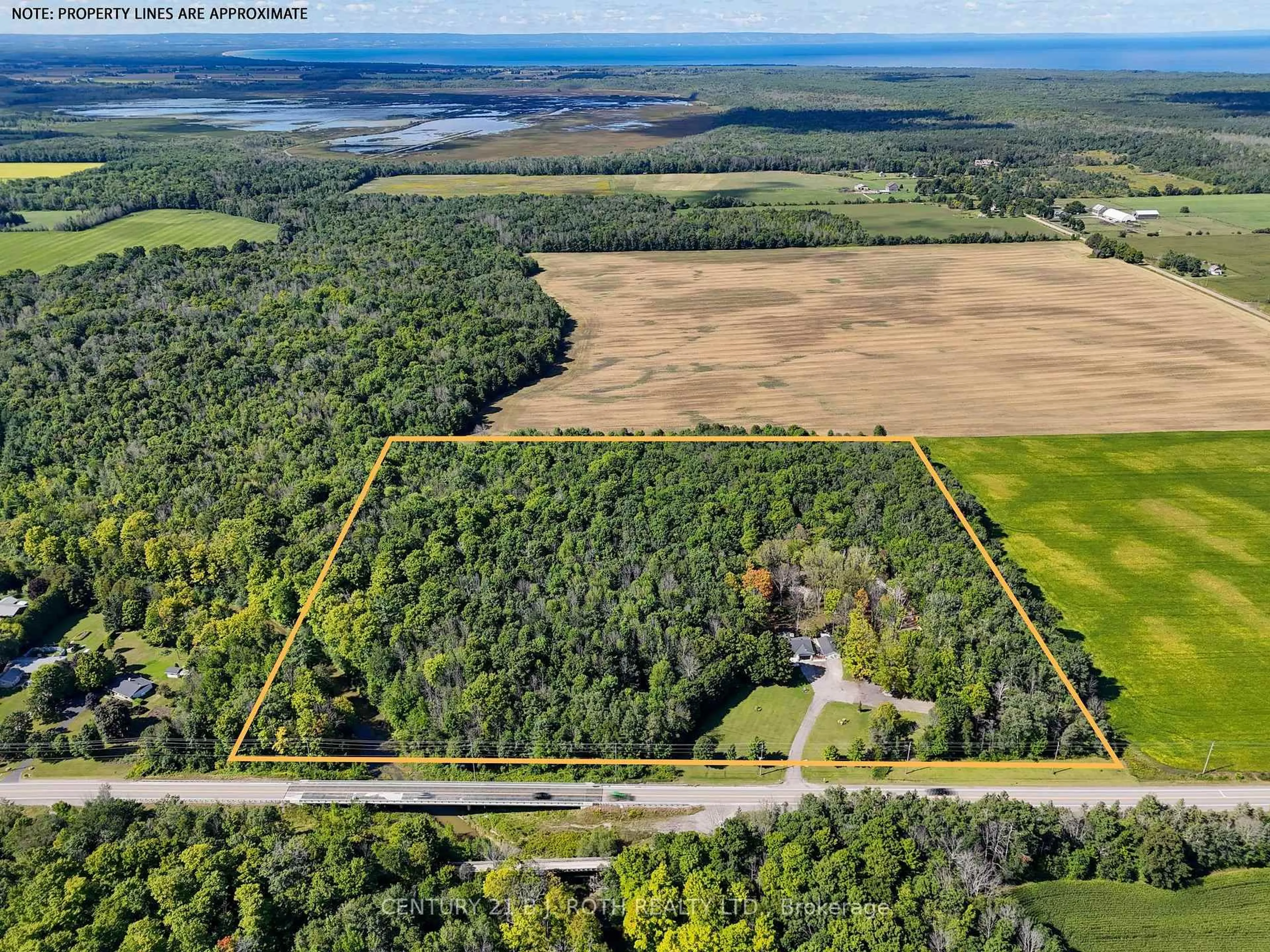 A pic from outside/outdoor area/front of a property/back of a property/a pic from drone, forest/trees view for 1250 County Road 6 Rd, Tiny Ontario L0L 2T0