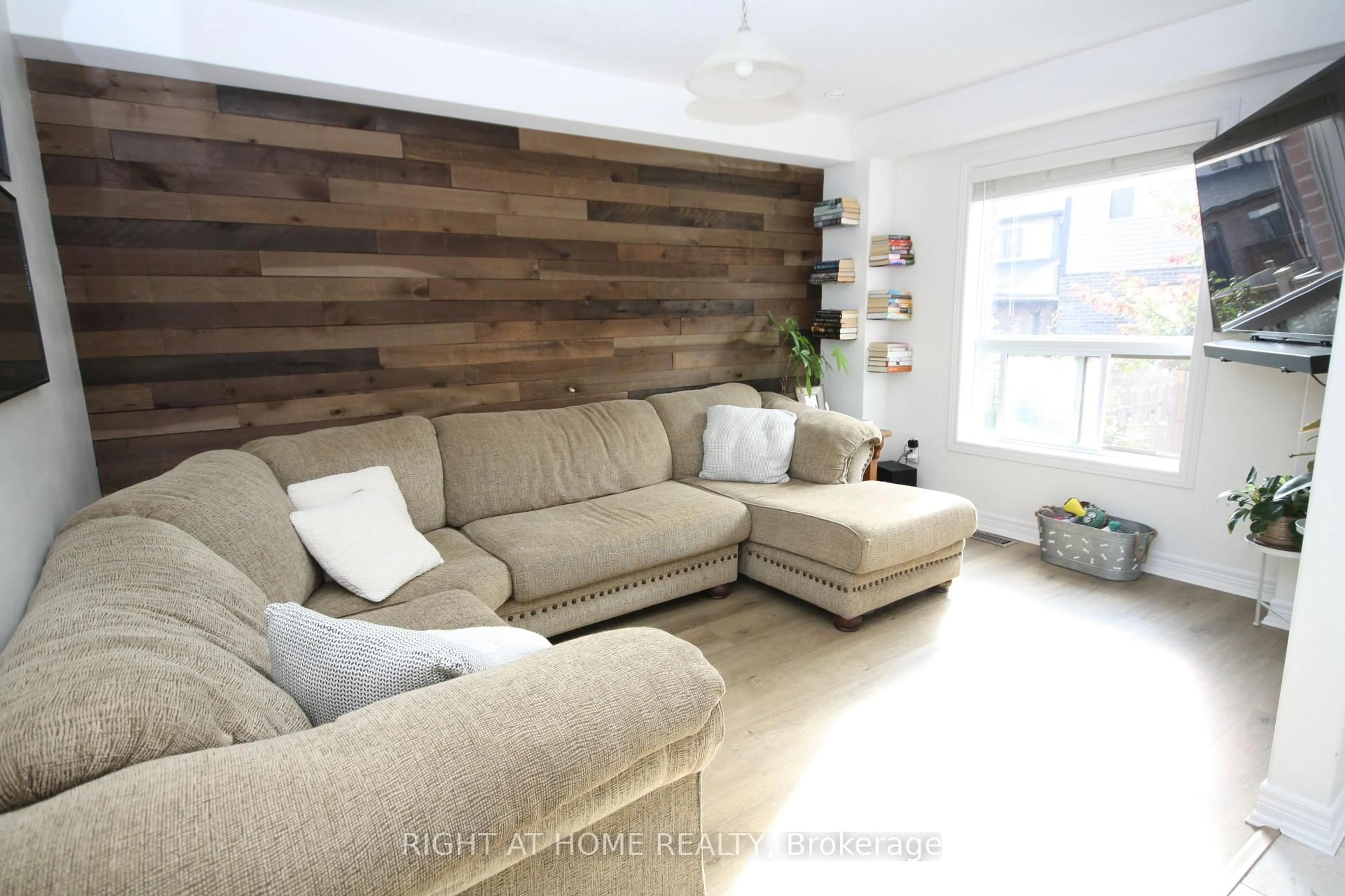 Living room with furniture, wood/laminate floor for 1039 Cook Dr, Midland Ontario L4R 0E4