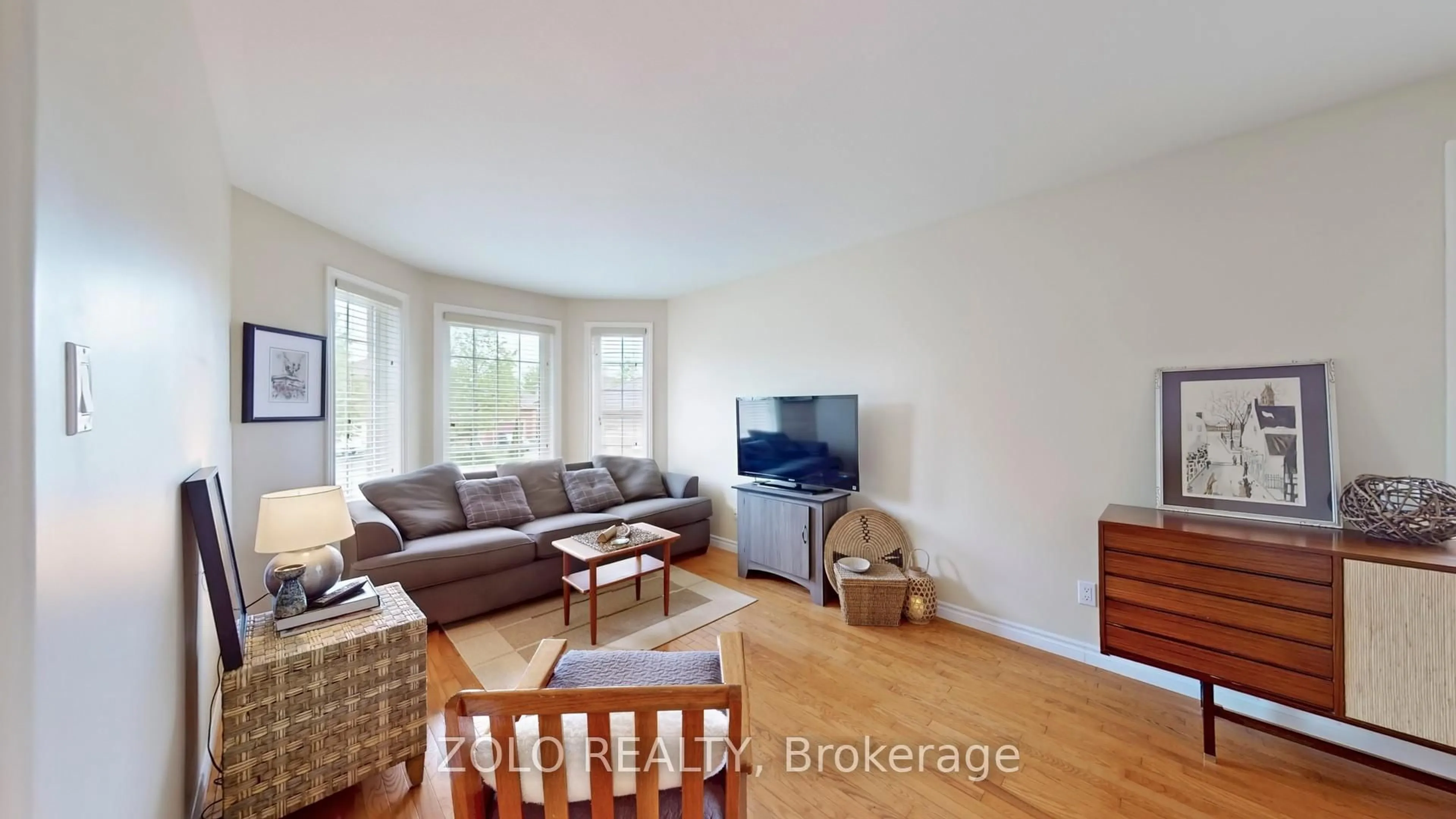 Living room with furniture, wood/laminate floor for 7 Golden Eagle Way, Barrie Ontario L4M 6P6