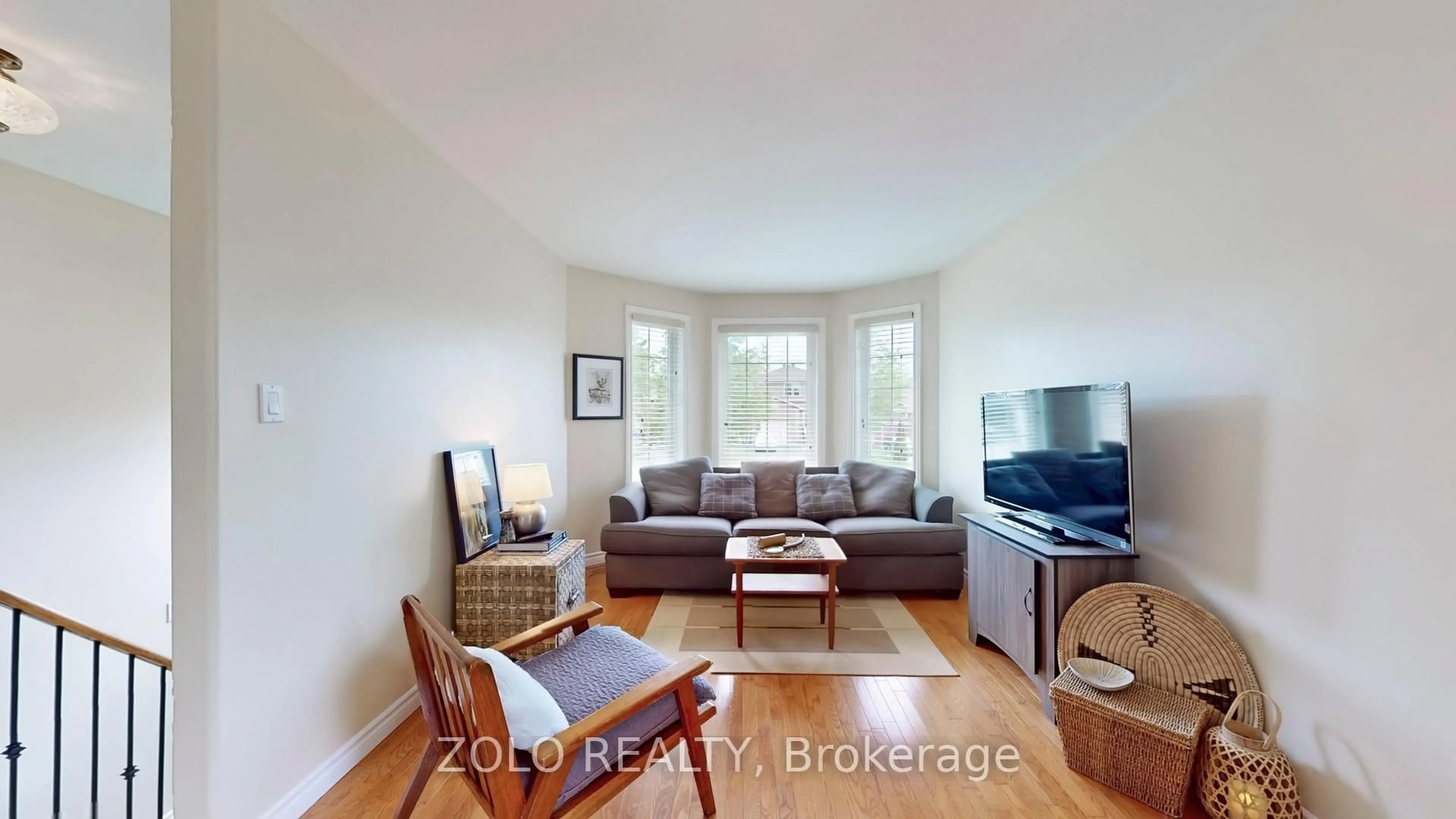 Living room with furniture, wood/laminate floor for 7 Golden Eagle Way, Barrie Ontario L4M 6P6