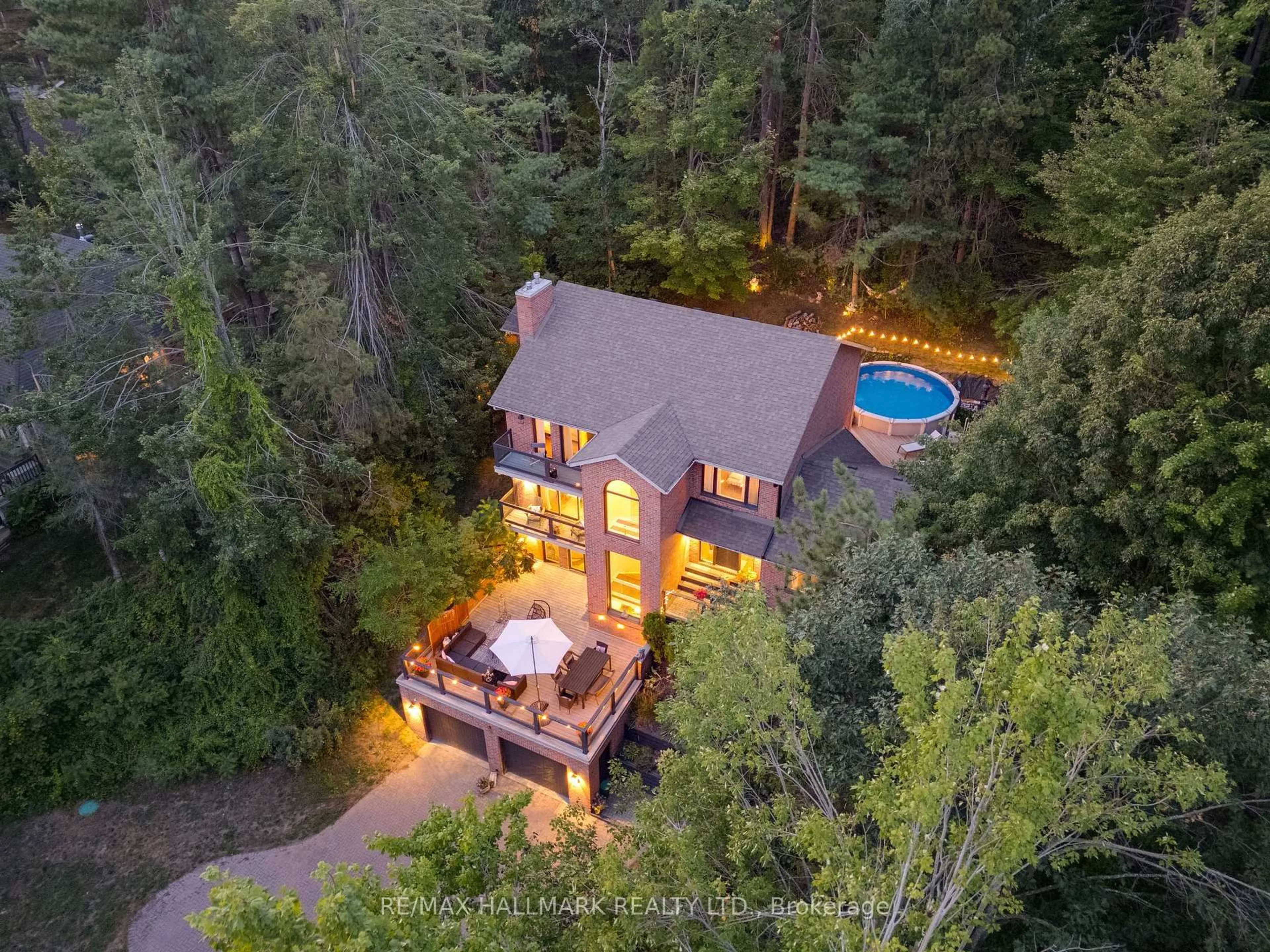 A pic from outside/outdoor area/front of a property/back of a property/a pic from drone, forest/trees view for 30 Pooles Rd, Springwater Ontario L0L 1X1