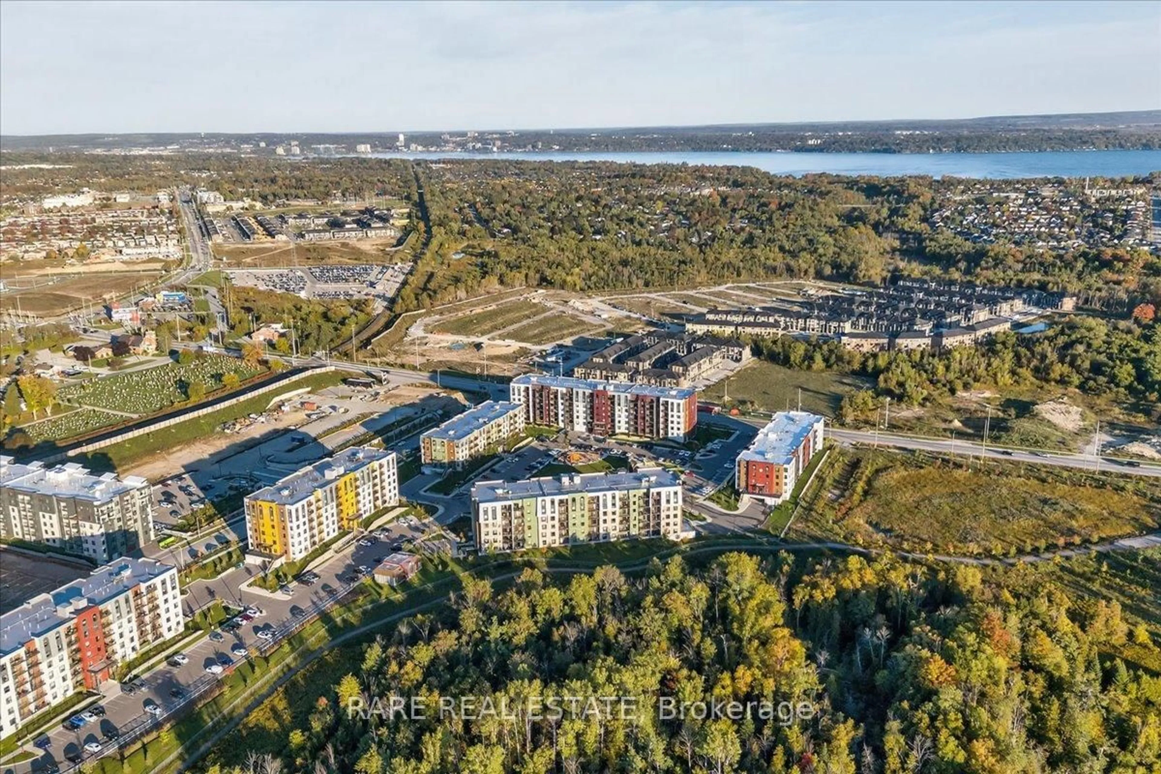 A pic from outside/outdoor area/front of a property/back of a property/a pic from drone, water/lake/river/ocean view for 5 Chef Lane #402, Barrie Ontario L9J 0J8