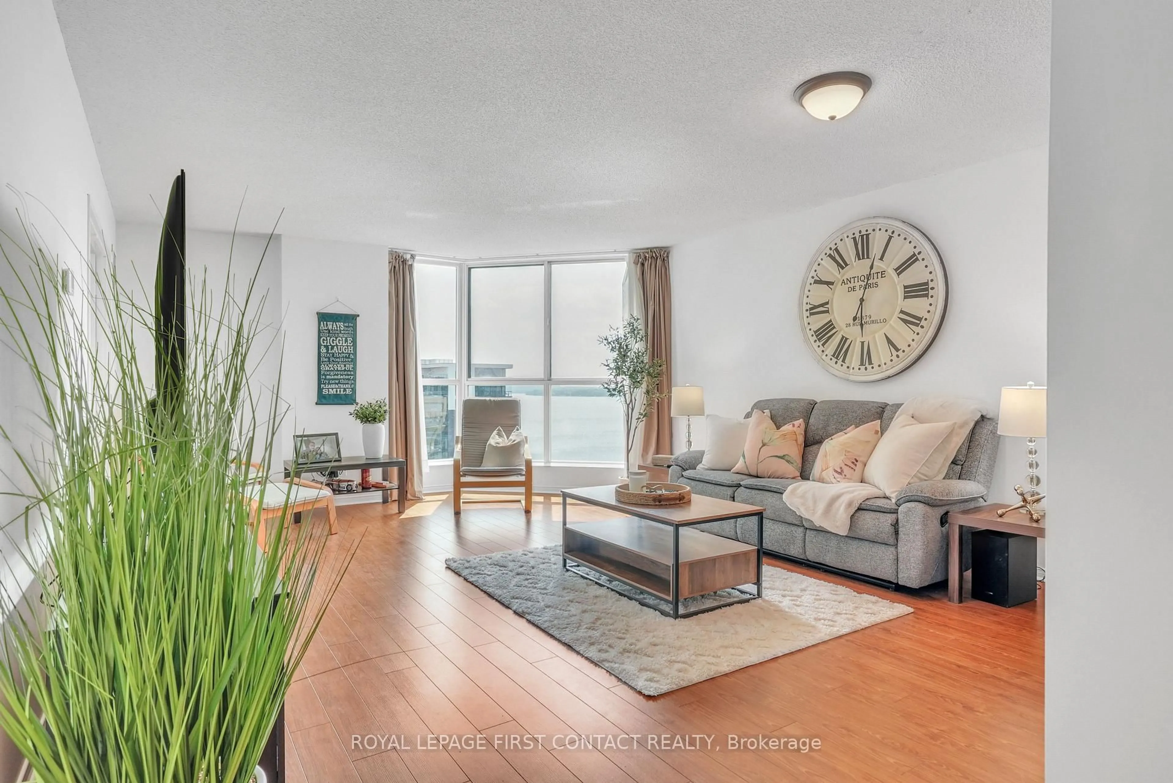 Living room with furniture, wood/laminate floor for 140 Dunlop St #908, Barrie Ontario L4M 6H9