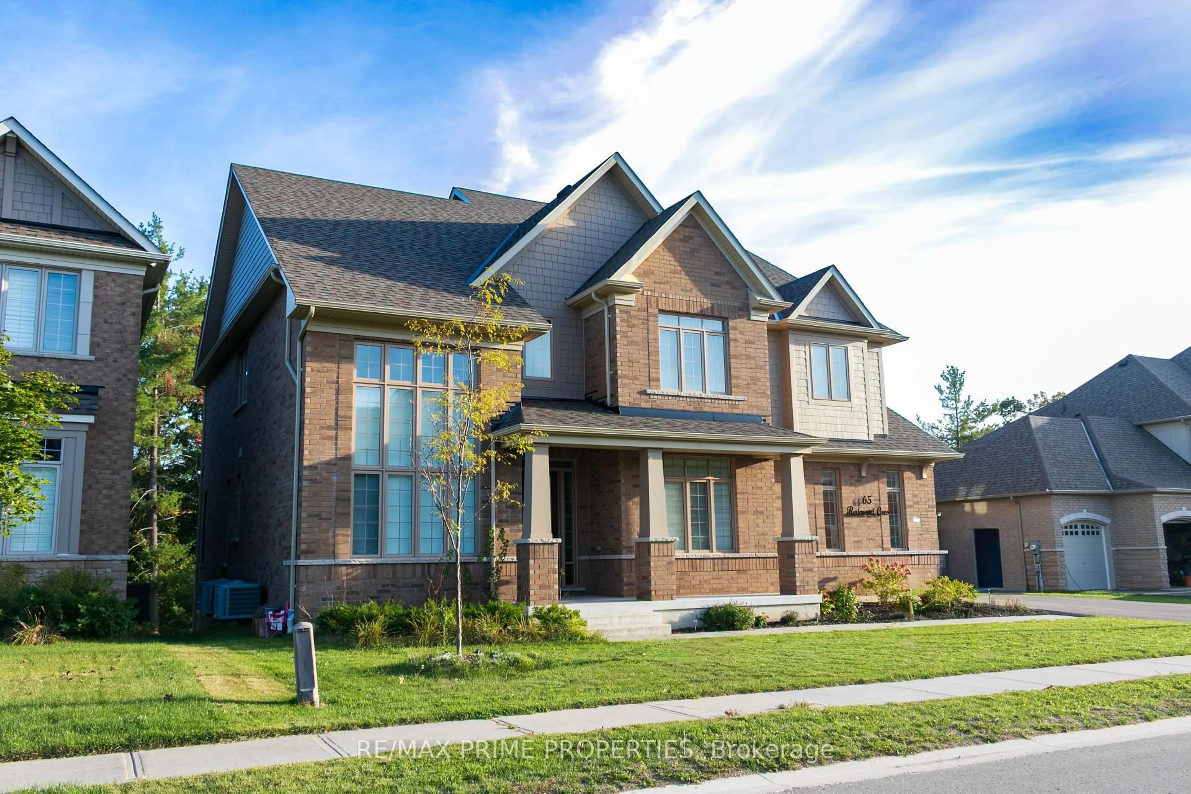 Home with brick exterior material, street for 65 Redmond Cres, Springwater Ontario L9X 1Z8