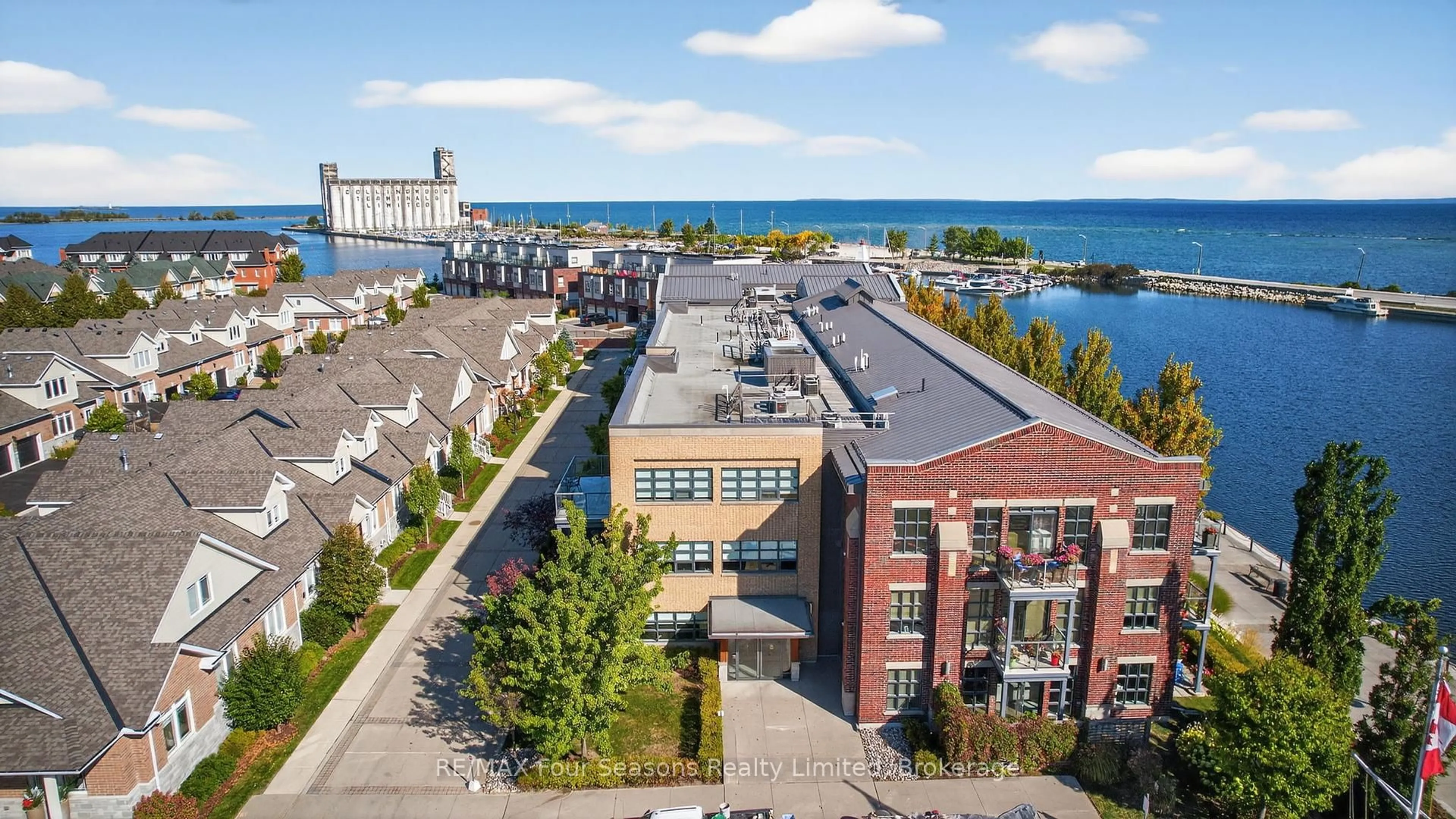 A pic from outside/outdoor area/front of a property/back of a property/a pic from drone, water/lake/river/ocean view for 1 Shipyard Lane #301, Collingwood Ontario L9Y 0W2