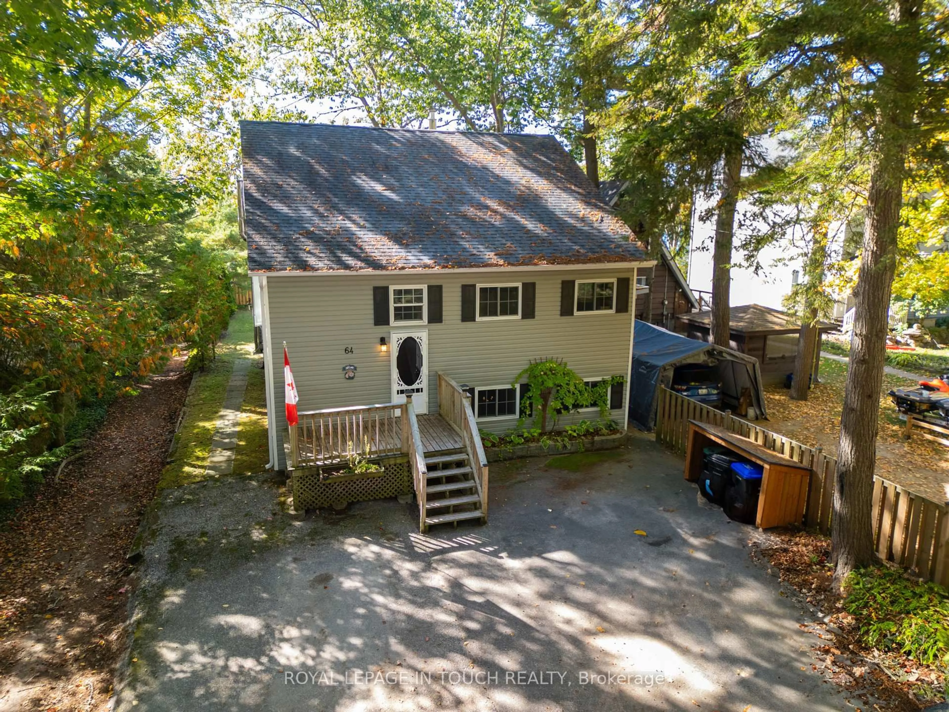 A pic from outside/outdoor area/front of a property/back of a property/a pic from drone, street for 64 Wahnekewening Dr, Tiny Ontario L0L 2J0