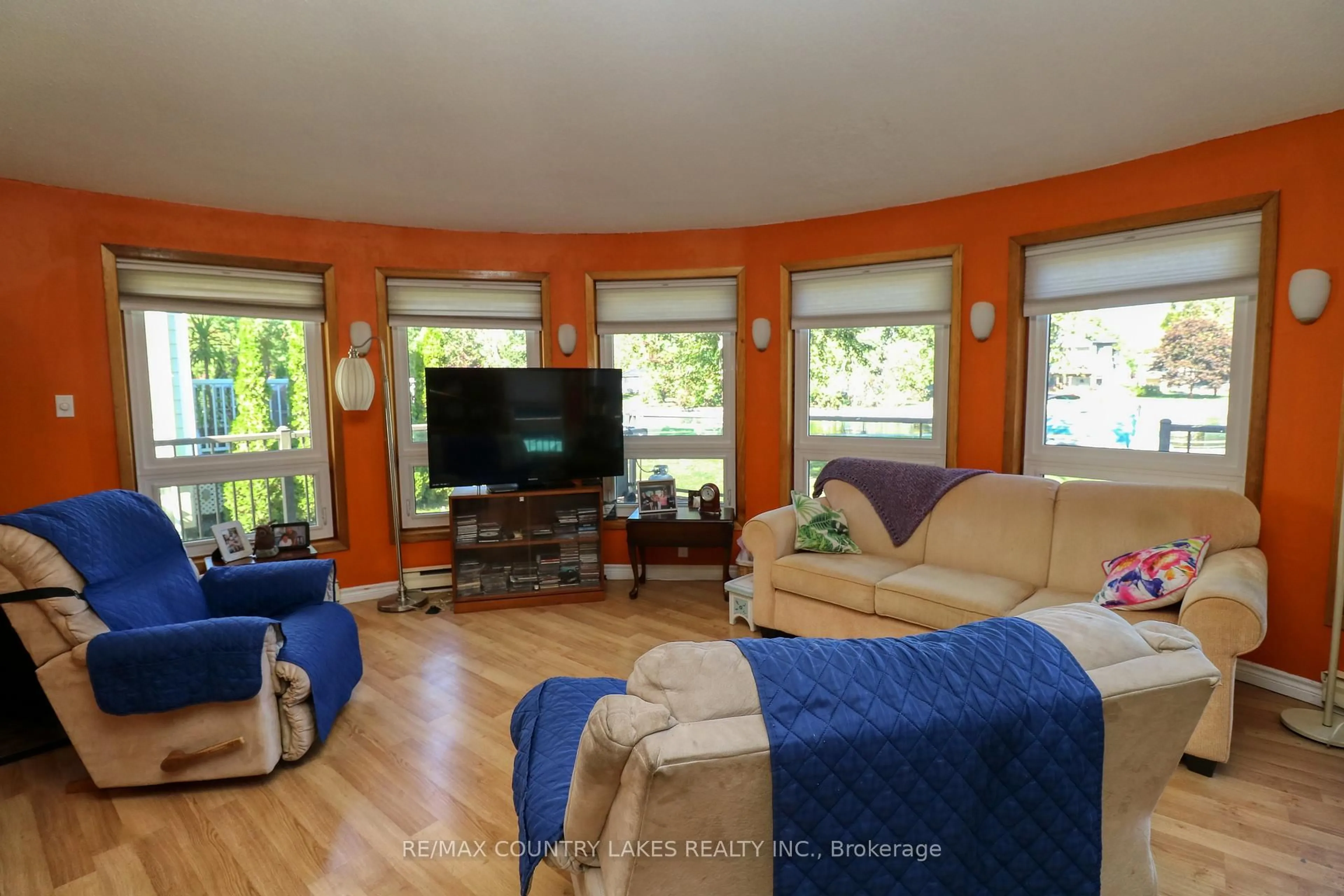 Living room with furniture, wood/laminate floor for 34 Simcoe Rd, Ramara Ontario L0K 1B0