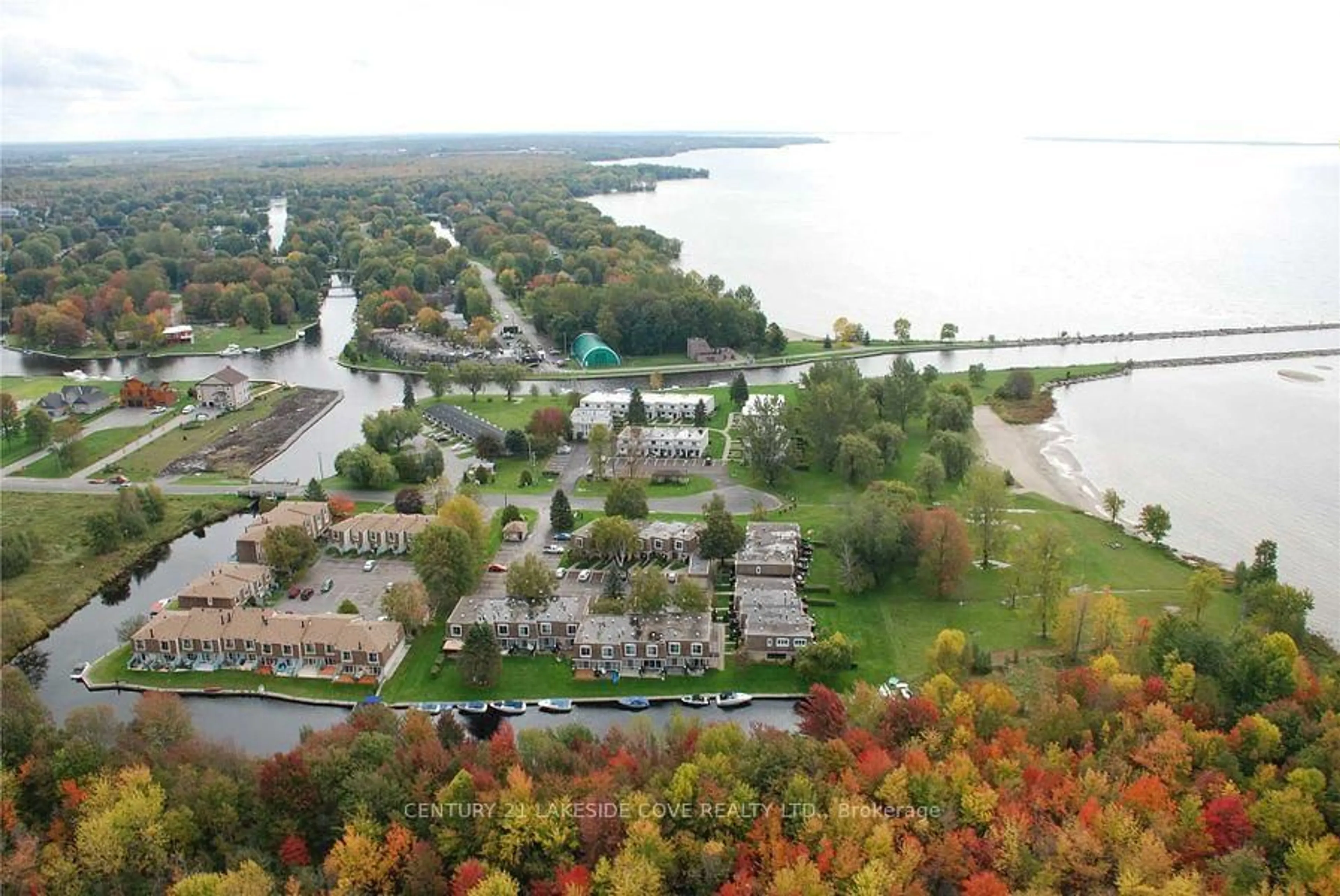 A pic from outside/outdoor area/front of a property/back of a property/a pic from drone, water/lake/river/ocean view for 1 Paradise Blvd #Unit 27, Ramara Ontario L0K 1B0