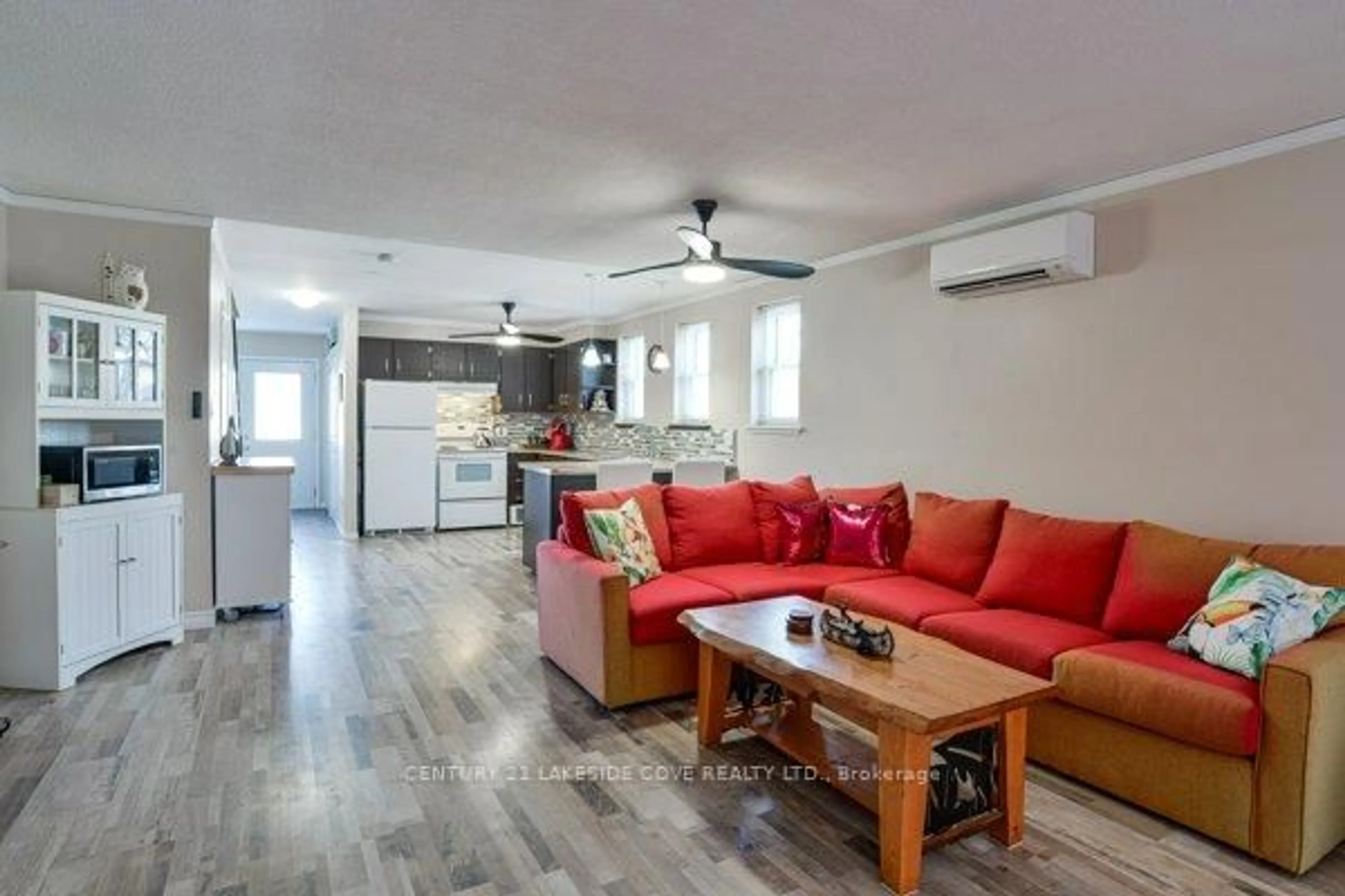 Living room with furniture, wood/laminate floor for 1 Paradise Blvd #Unit 27, Ramara Ontario L0K 1B0