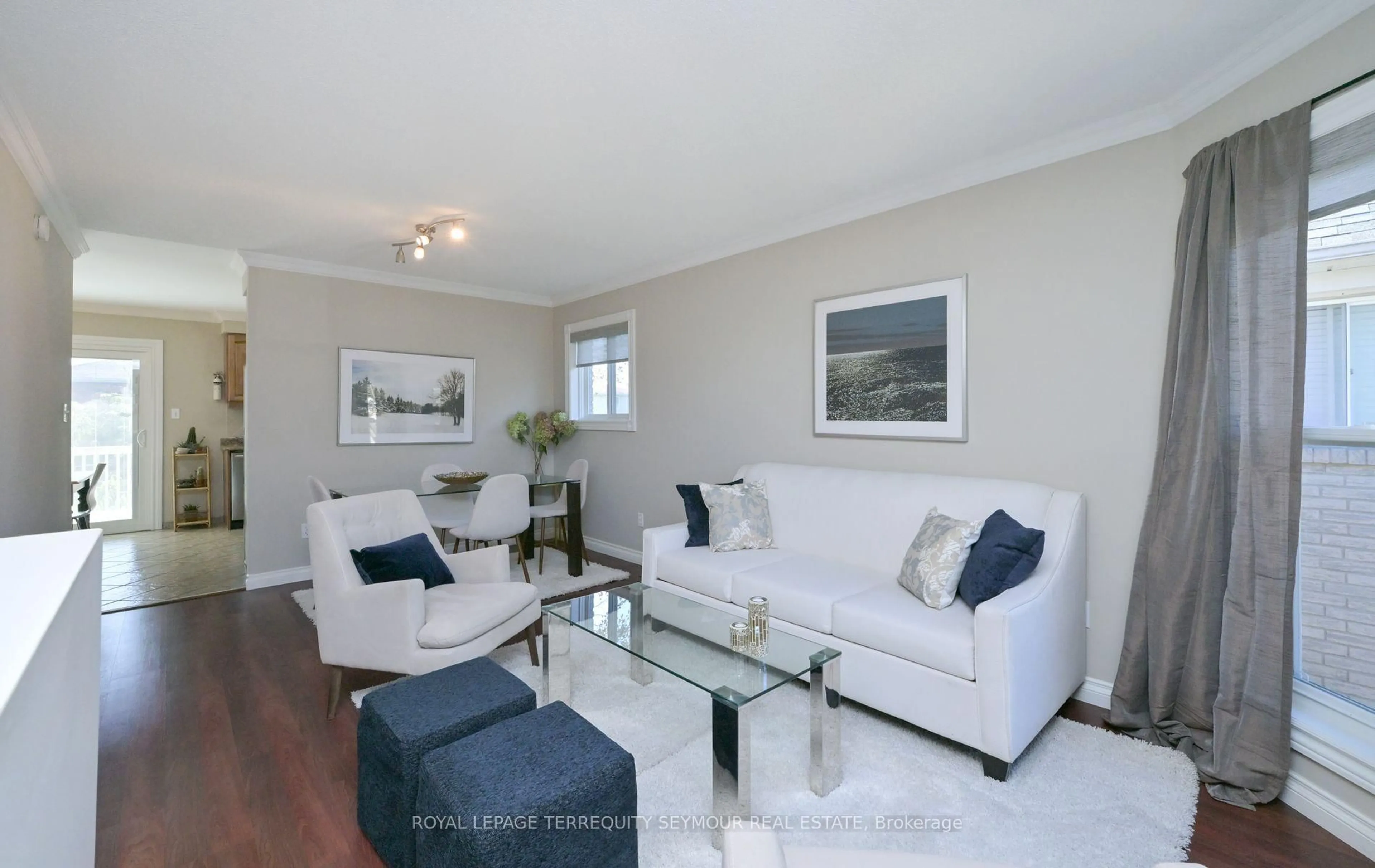 Living room with furniture, wood/laminate floor for 190 Wessenger Dr, Barrie Ontario L4N 8N9