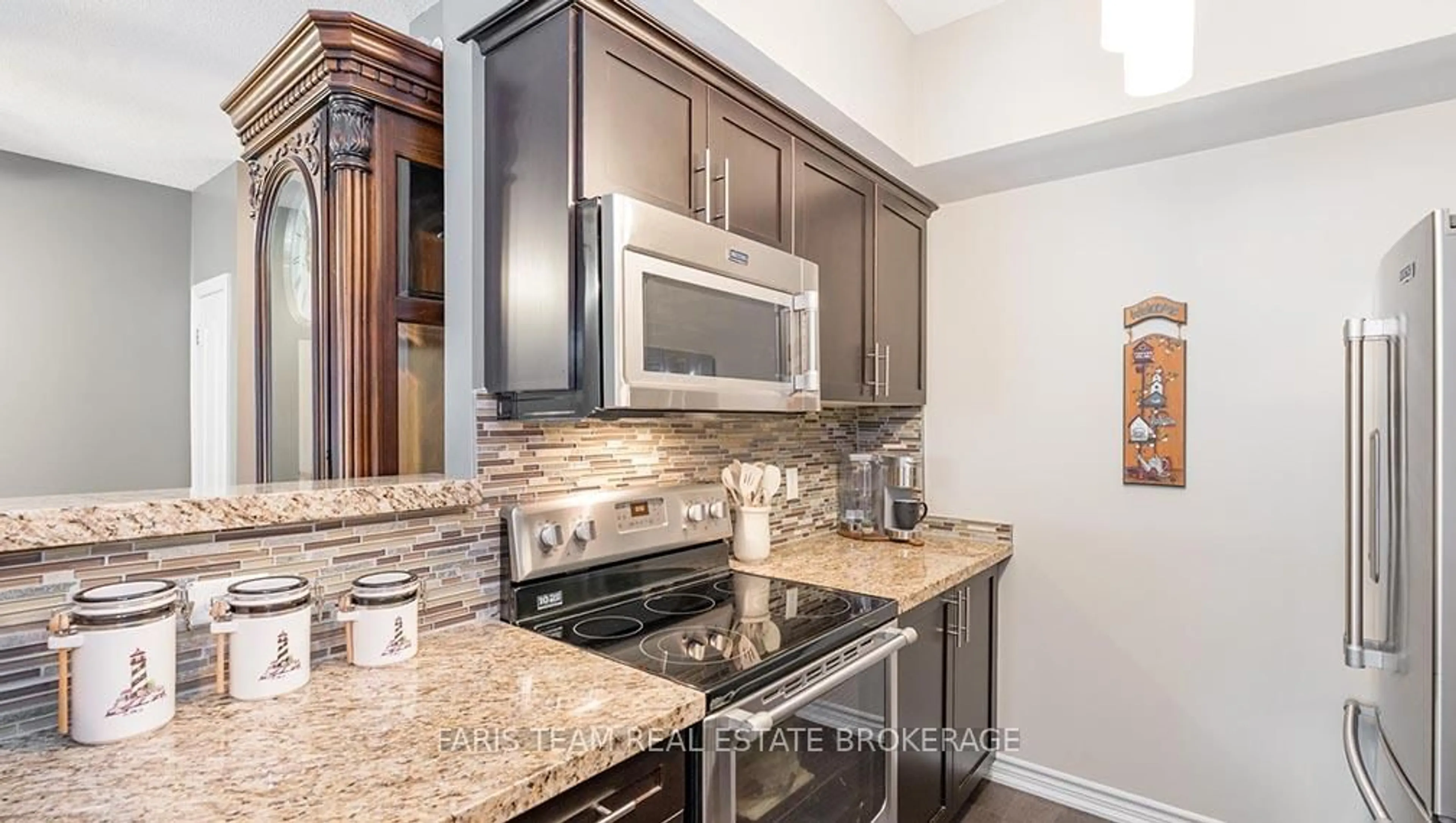 Open concept kitchen, ceramic/tile floor for 40 Ferndale Dr #210, Barrie Ontario L4N 2L3