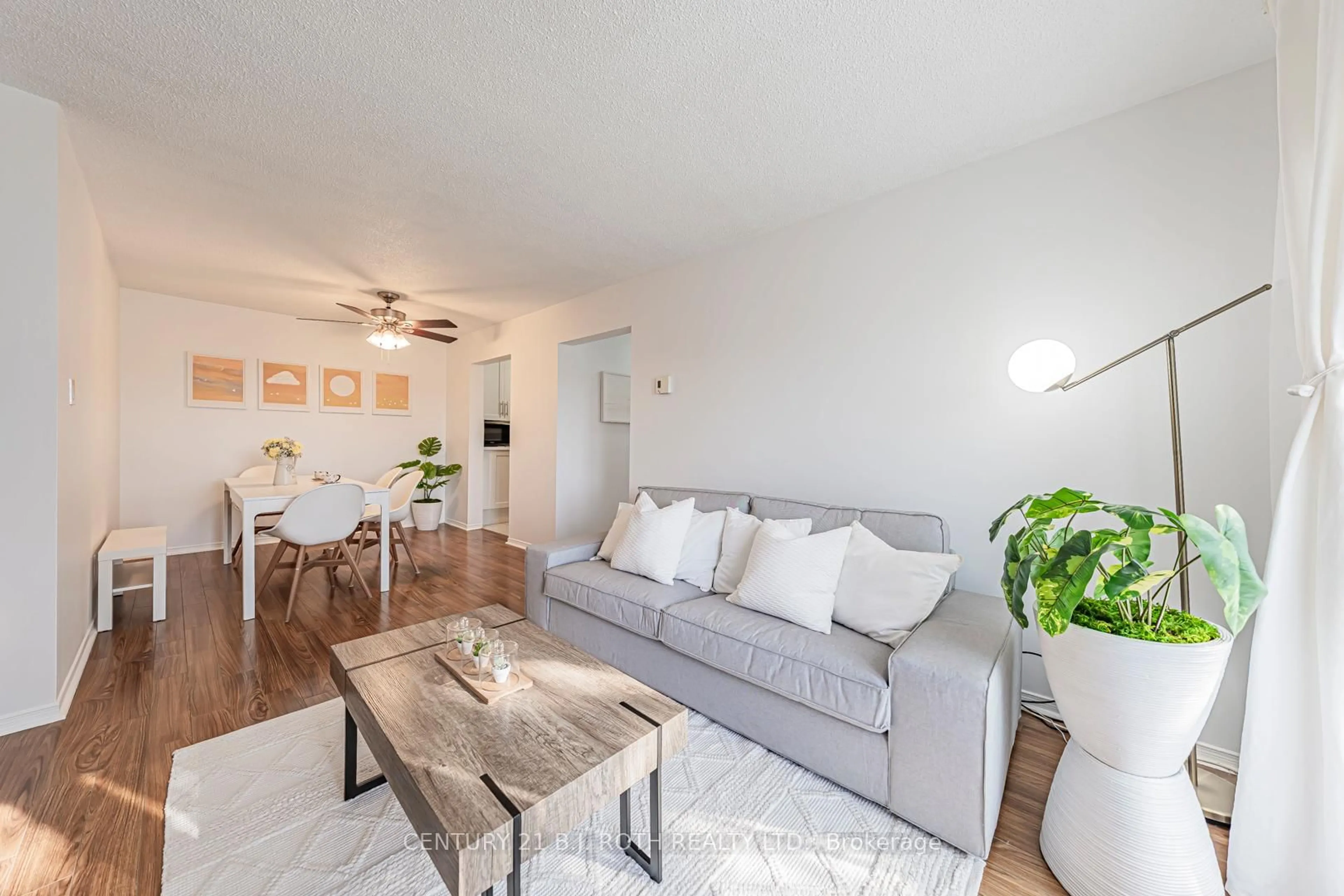 Living room with furniture, wood/laminate floor for 147 EDGEHILL Dr #G10, Barrie Ontario L4N 1L9