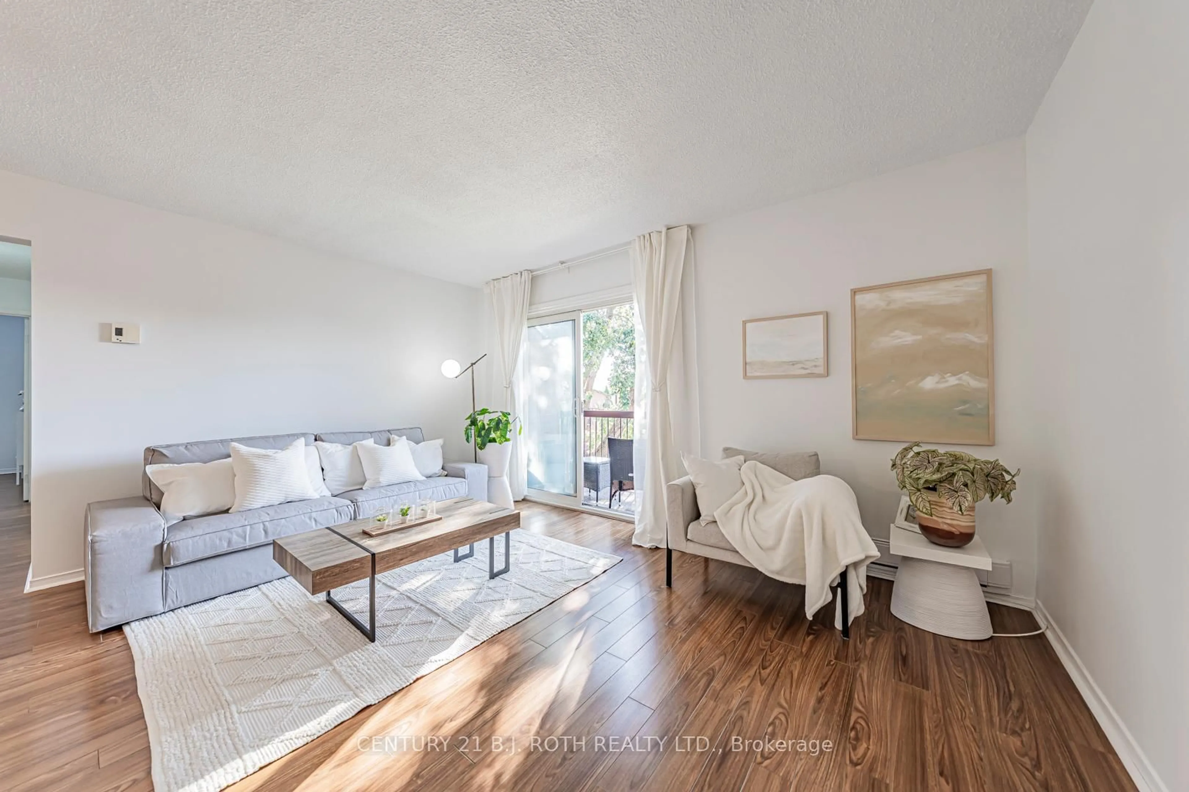 Living room with furniture, wood/laminate floor for 147 EDGEHILL Dr #G10, Barrie Ontario L4N 1L9