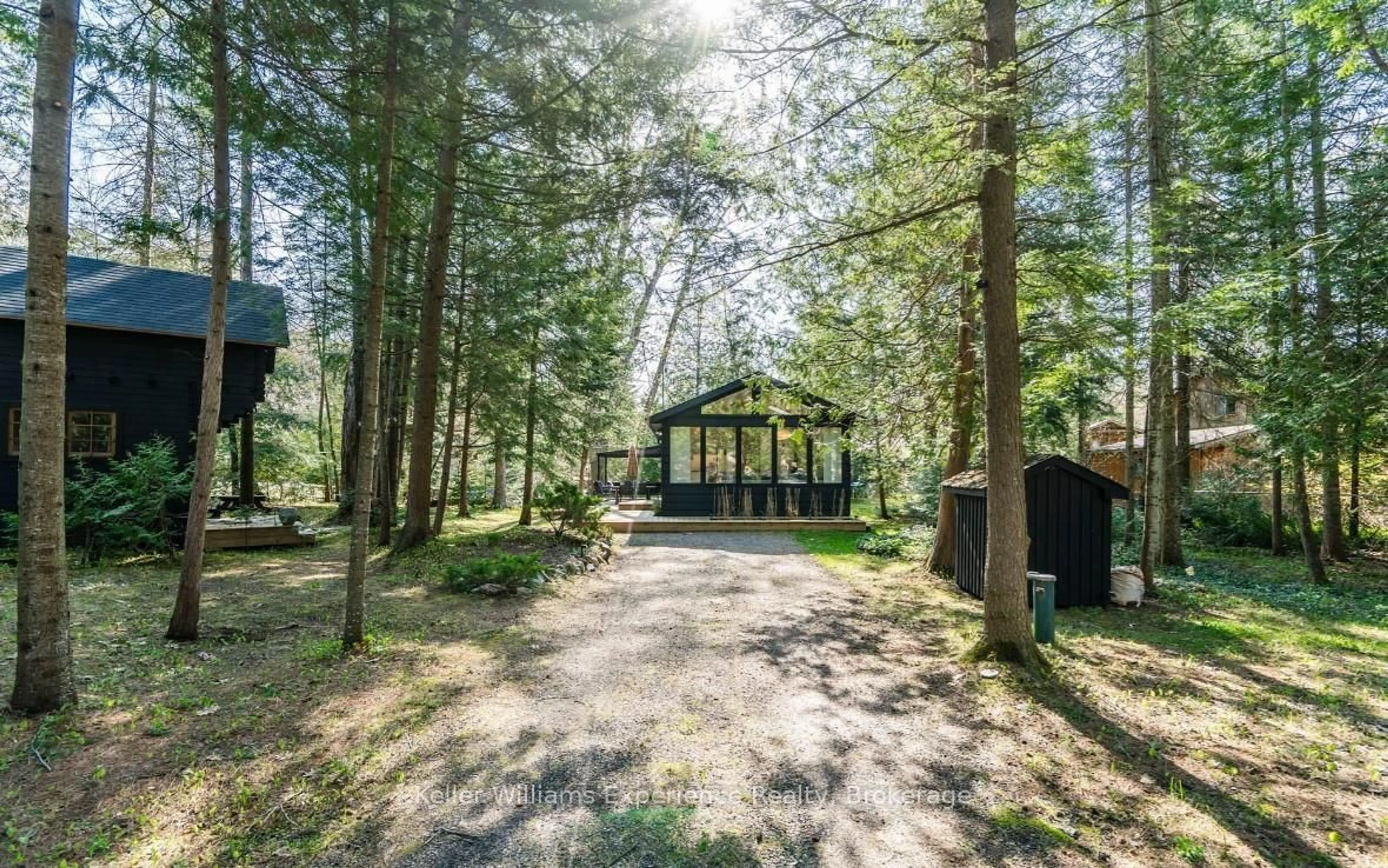 A pic from outside/outdoor area/front of a property/back of a property/a pic from drone, forest/trees view for 1 Sundown Rd, Tiny Ontario L0L 2J0