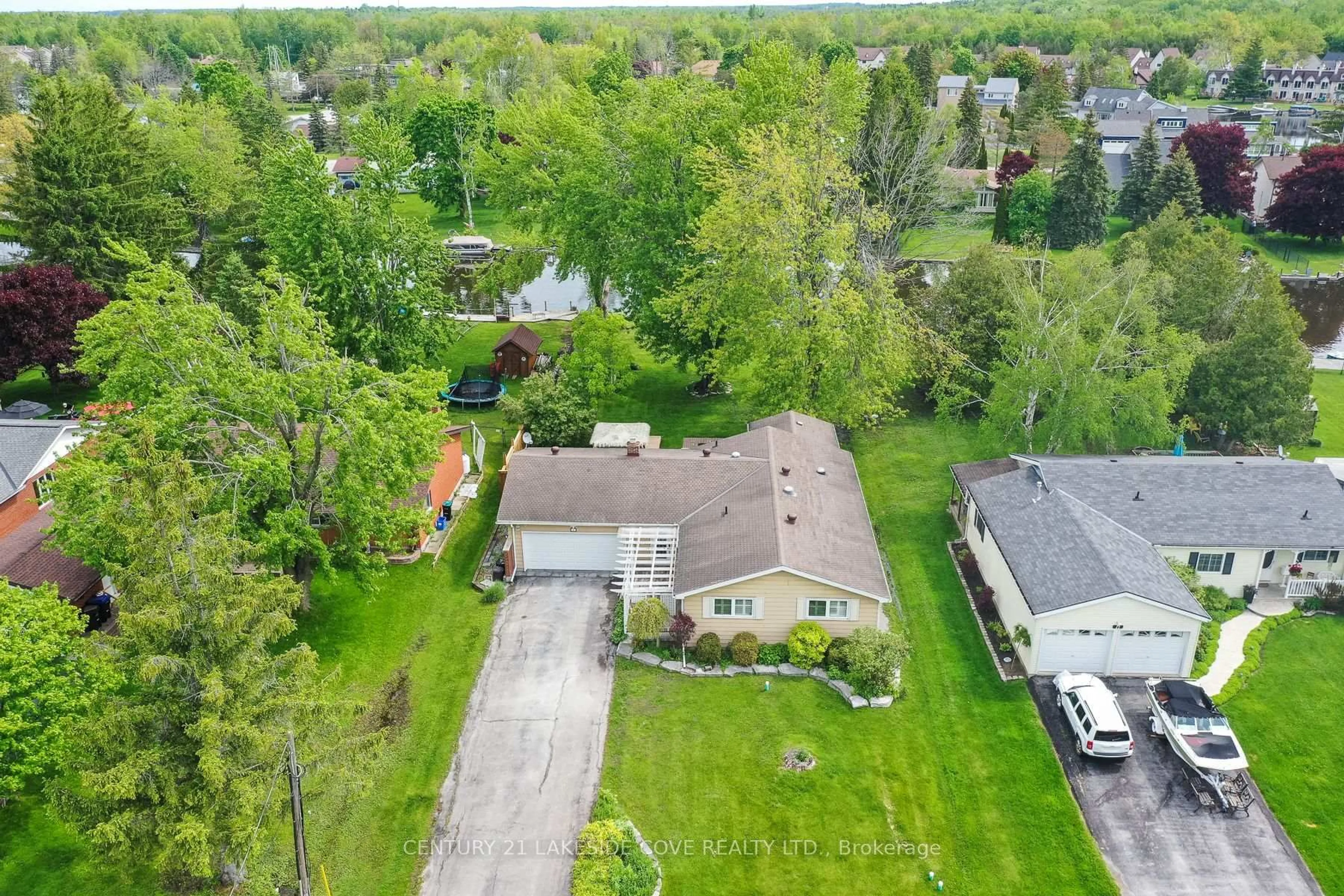 A pic from outside/outdoor area/front of a property/back of a property/a pic from drone, street for 9 Pinetree Crt, Ramara Ontario L0K 1B0