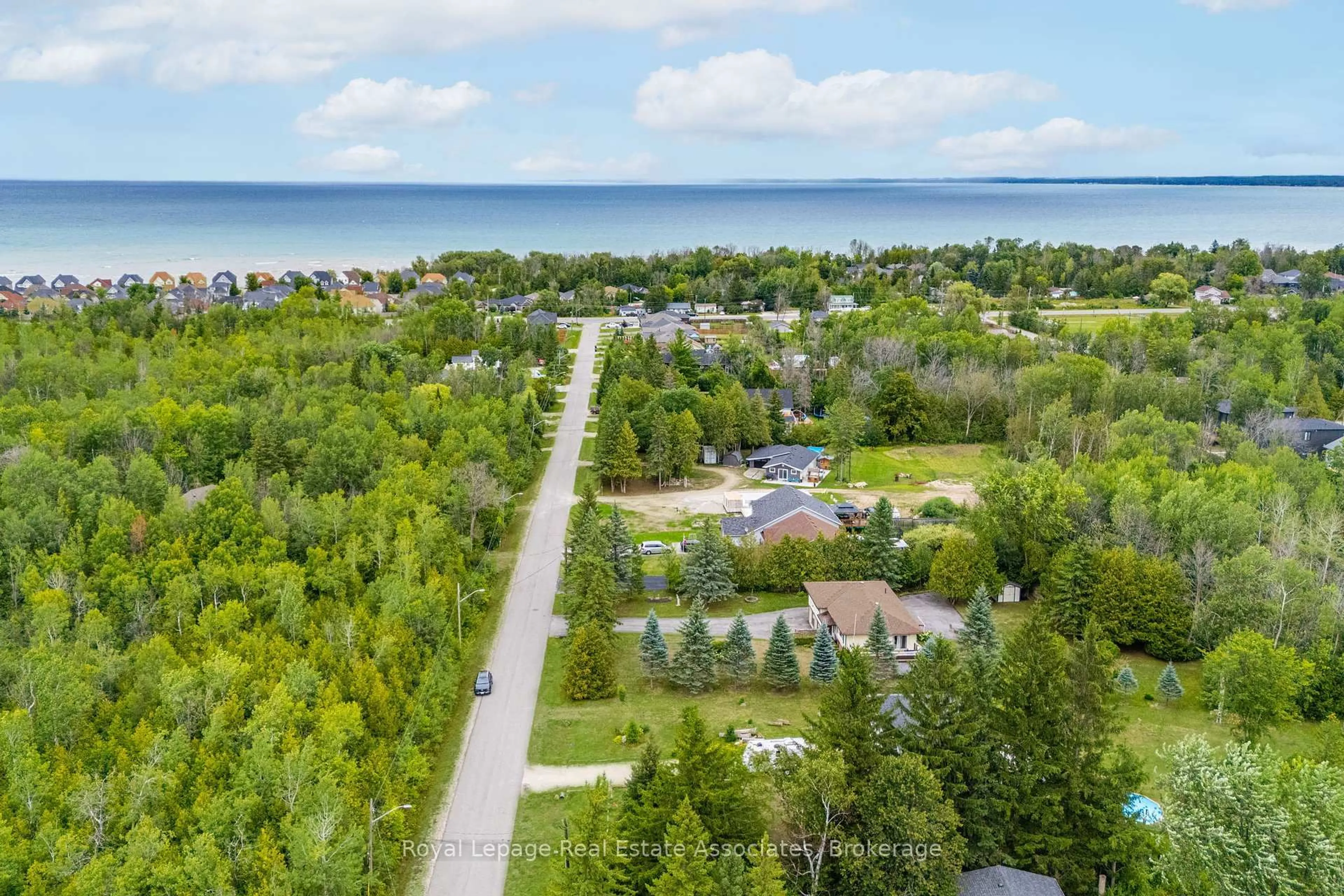 A pic from outside/outdoor area/front of a property/back of a property/a pic from drone, water/lake/river/ocean view for 69 George Ave, Wasaga Beach Ontario L9Z 2X9