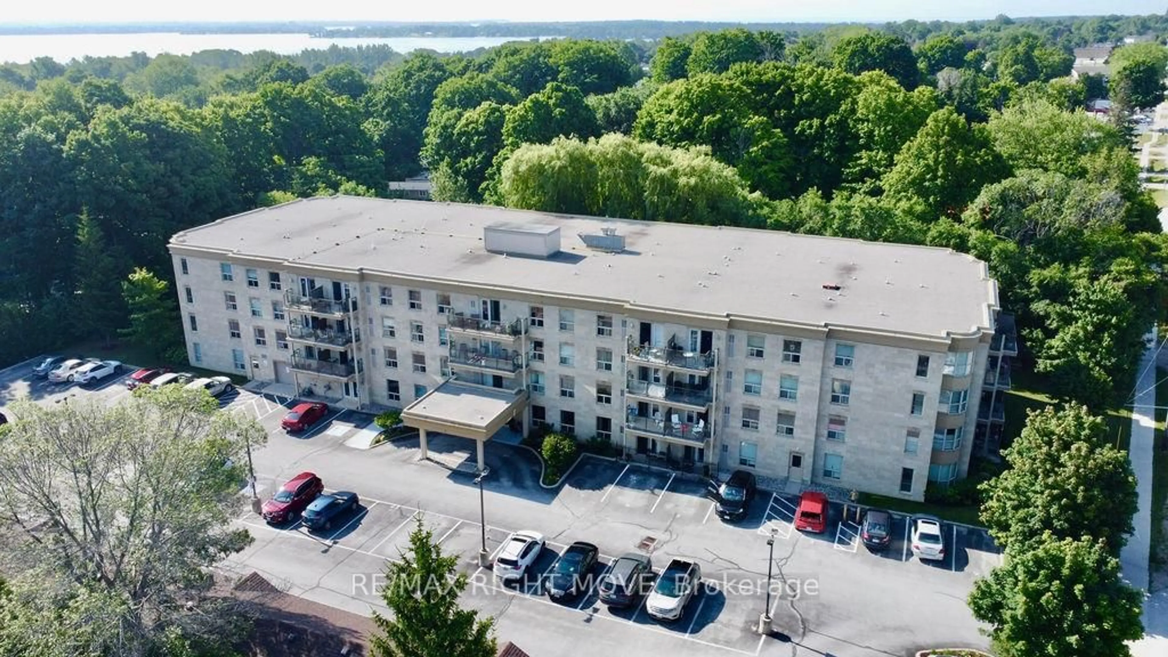 A pic from outside/outdoor area/front of a property/back of a property/a pic from drone, unknown for 486 Laclie St #313, Orillia Ontario L3V 4P9