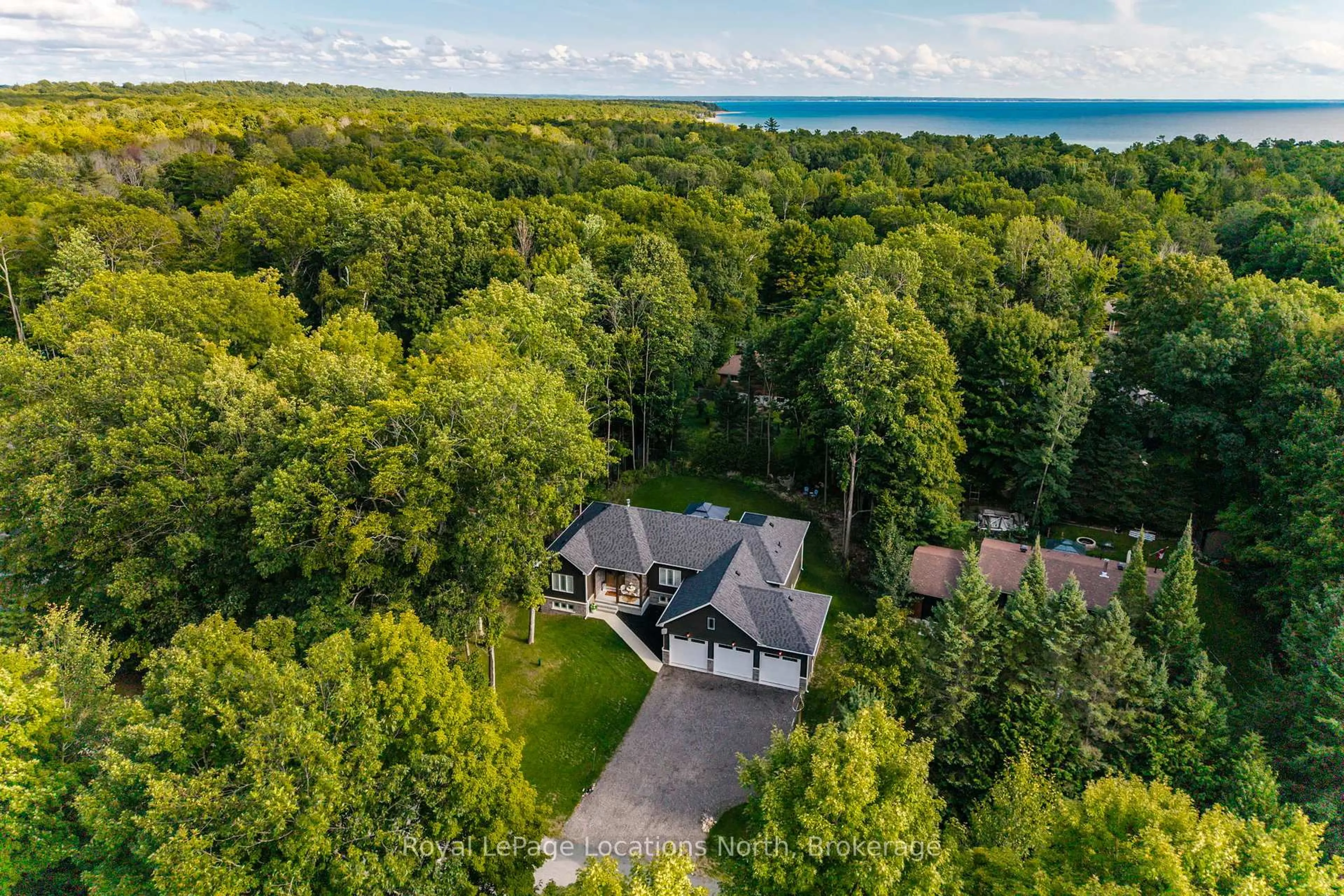 A pic from outside/outdoor area/front of a property/back of a property/a pic from drone, water/lake/river/ocean view for 15 Pinecone Ave, Tiny Ontario L9M 0J2