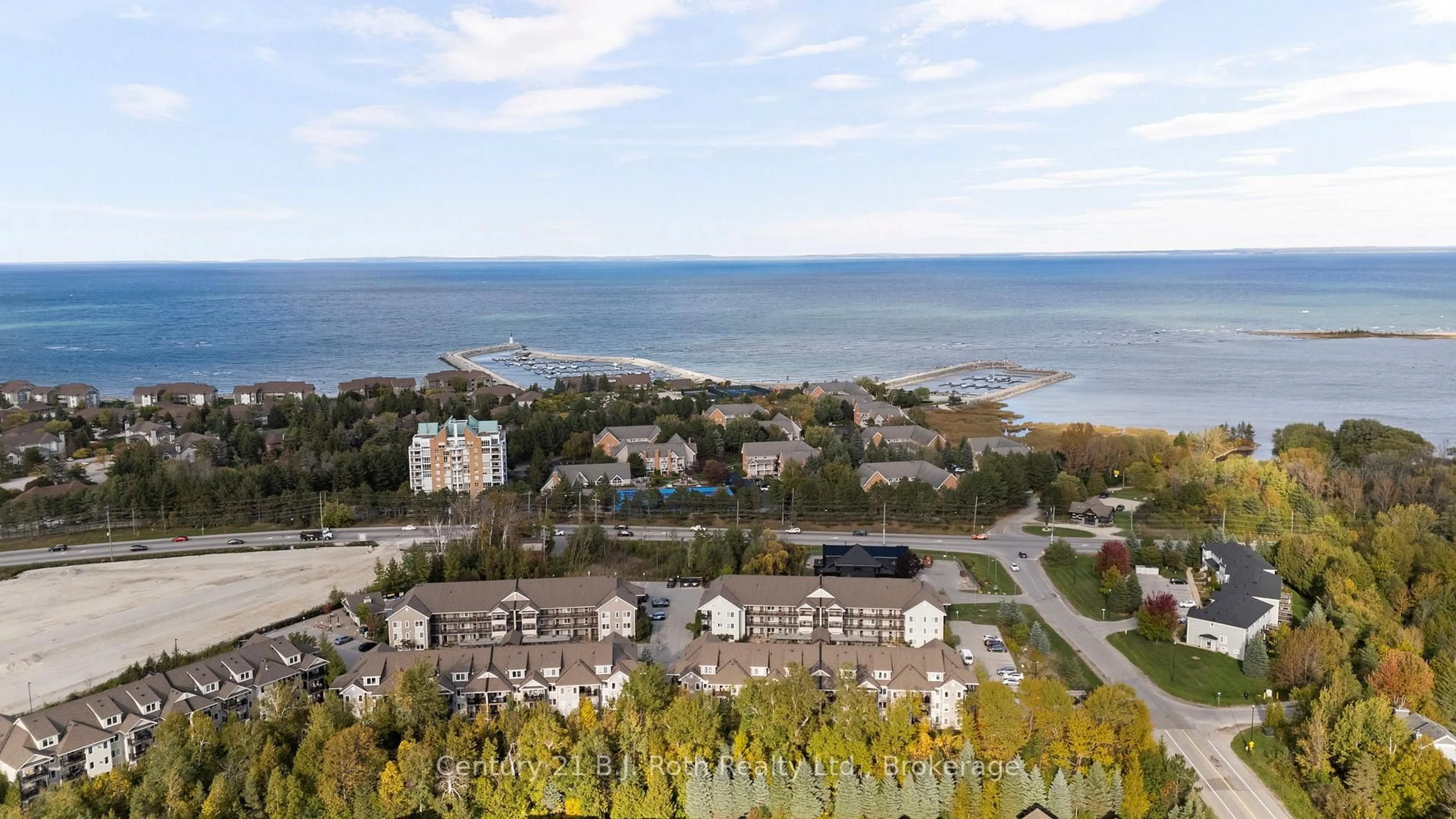A pic from outside/outdoor area/front of a property/back of a property/a pic from drone, water/lake/river/ocean view for 4 Brandy Lane Dr #104, Collingwood Ontario L9Y 0X4