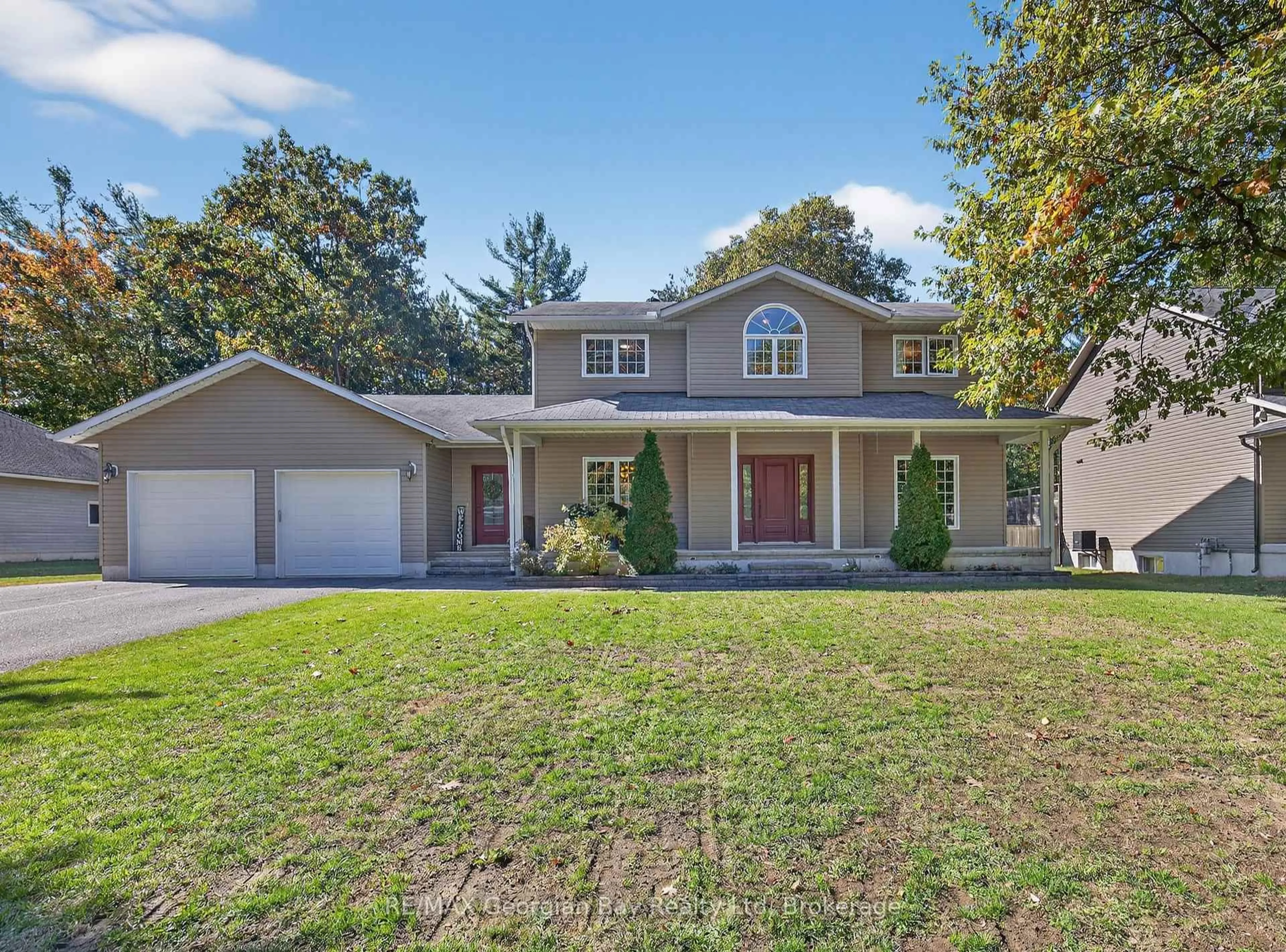 Home with vinyl exterior material, street for 32 Johnston St, Tiny Ontario L0L 2T0