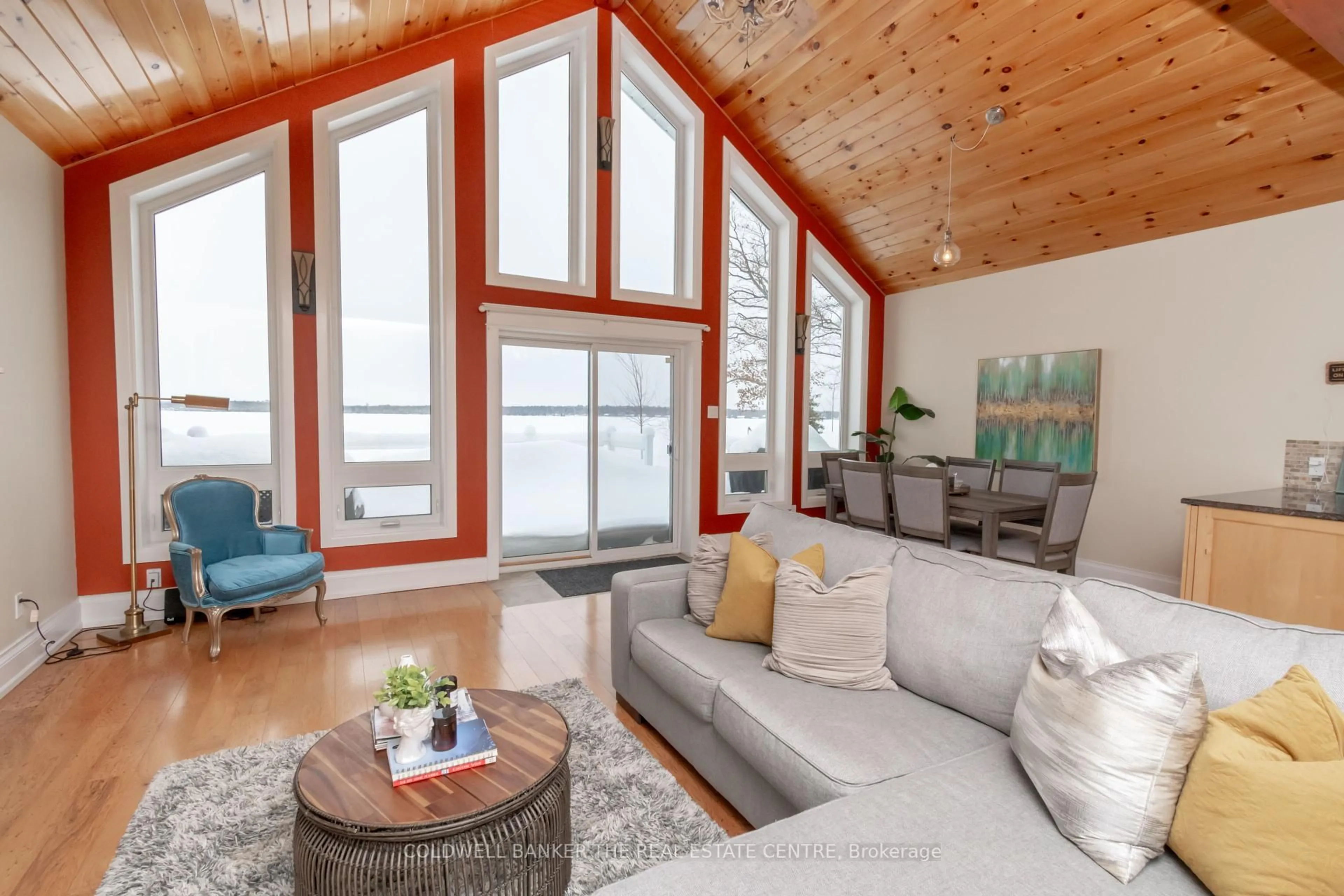 Living room with furniture, wood/laminate floor for 7304 Glen Ellen Dr, Ramara Ontario L0K 2B0