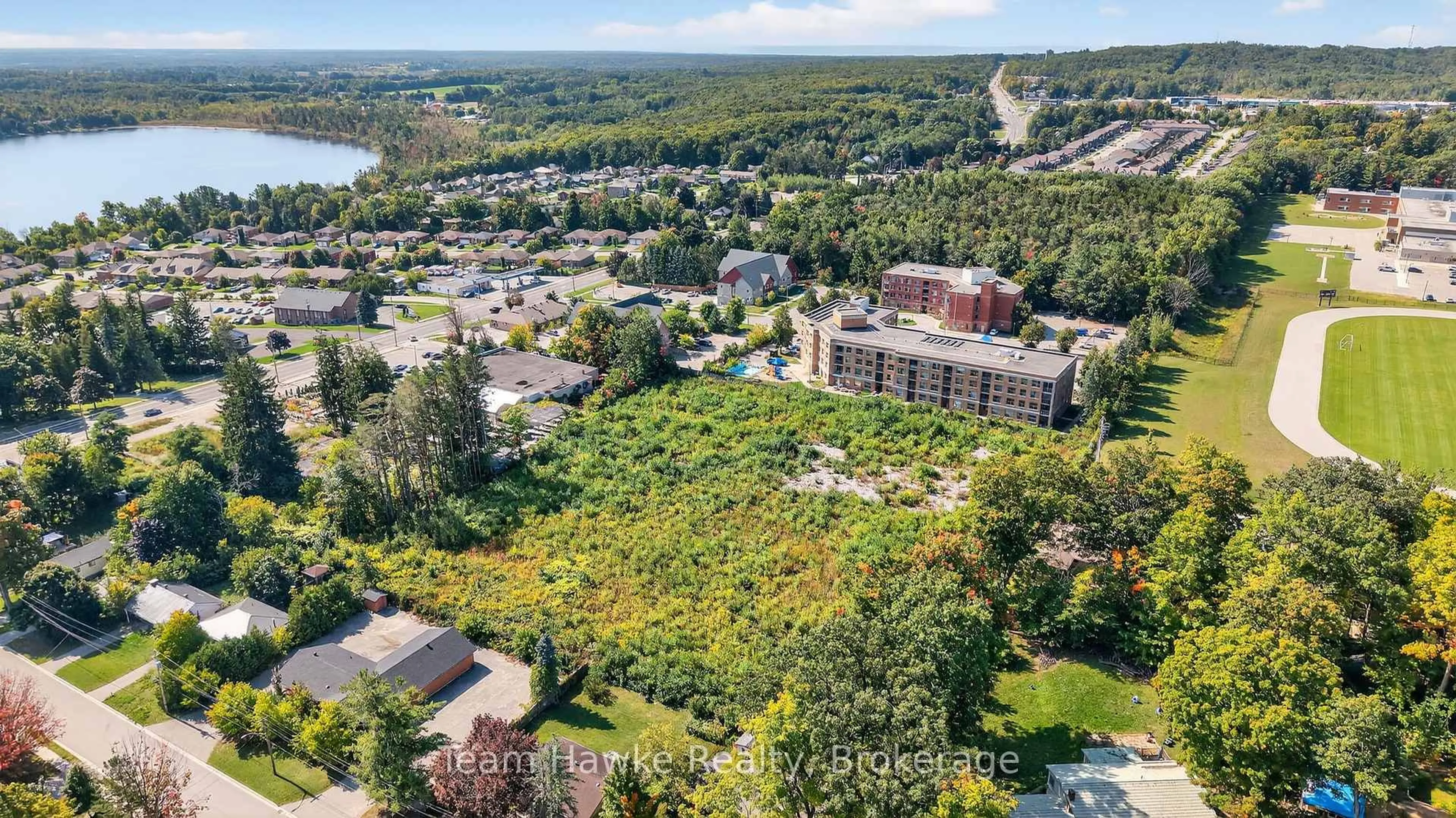 A pic from outside/outdoor area/front of a property/back of a property/a pic from drone, water/lake/river/ocean view for 319 Gervais St #2A, Midland Ontario L4R 4C6