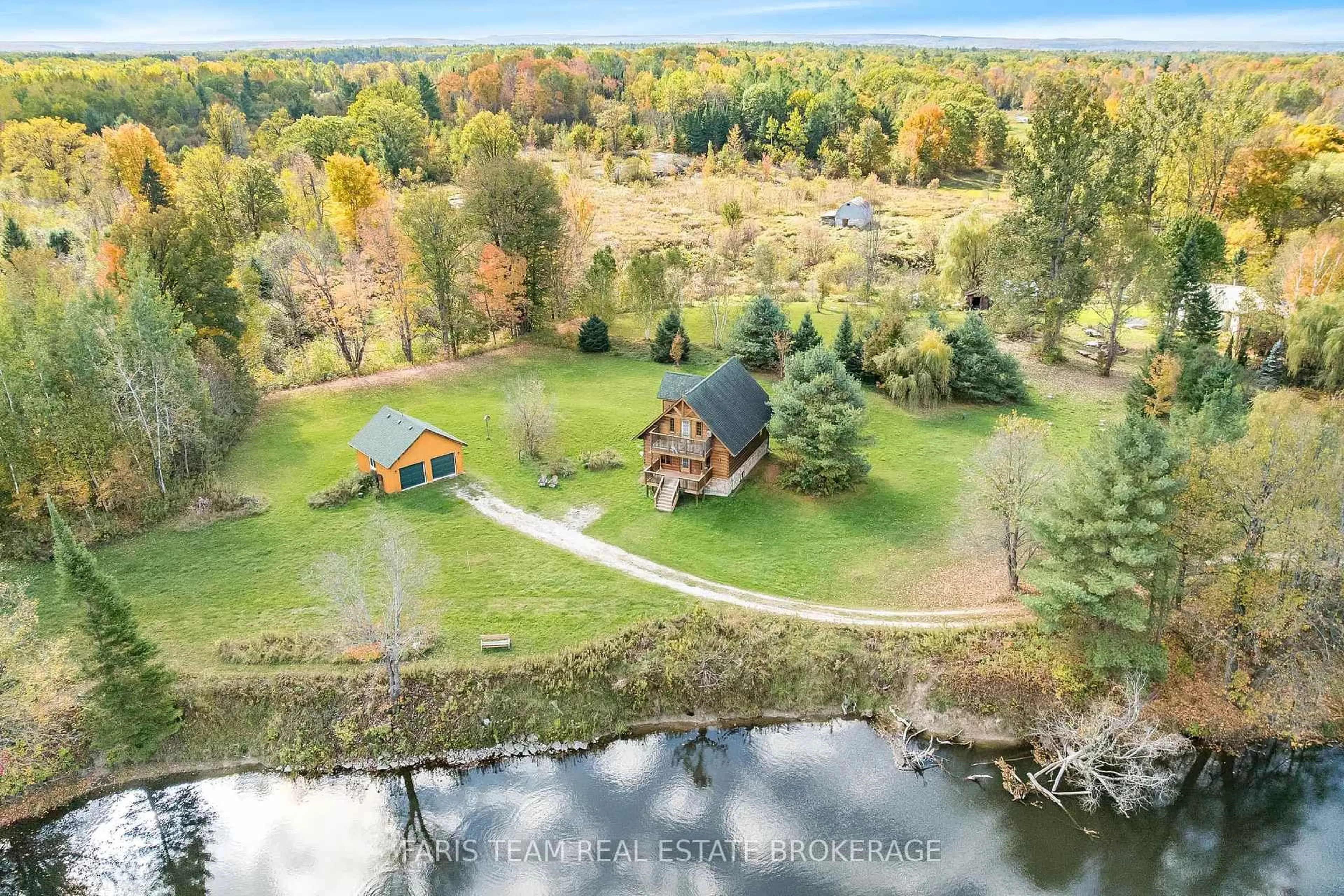 A pic from outside/outdoor area/front of a property/back of a property/a pic from drone, water/lake/river/ocean view for 1309 Laughlin Falls Rd, Severn Ontario L0K 1E0