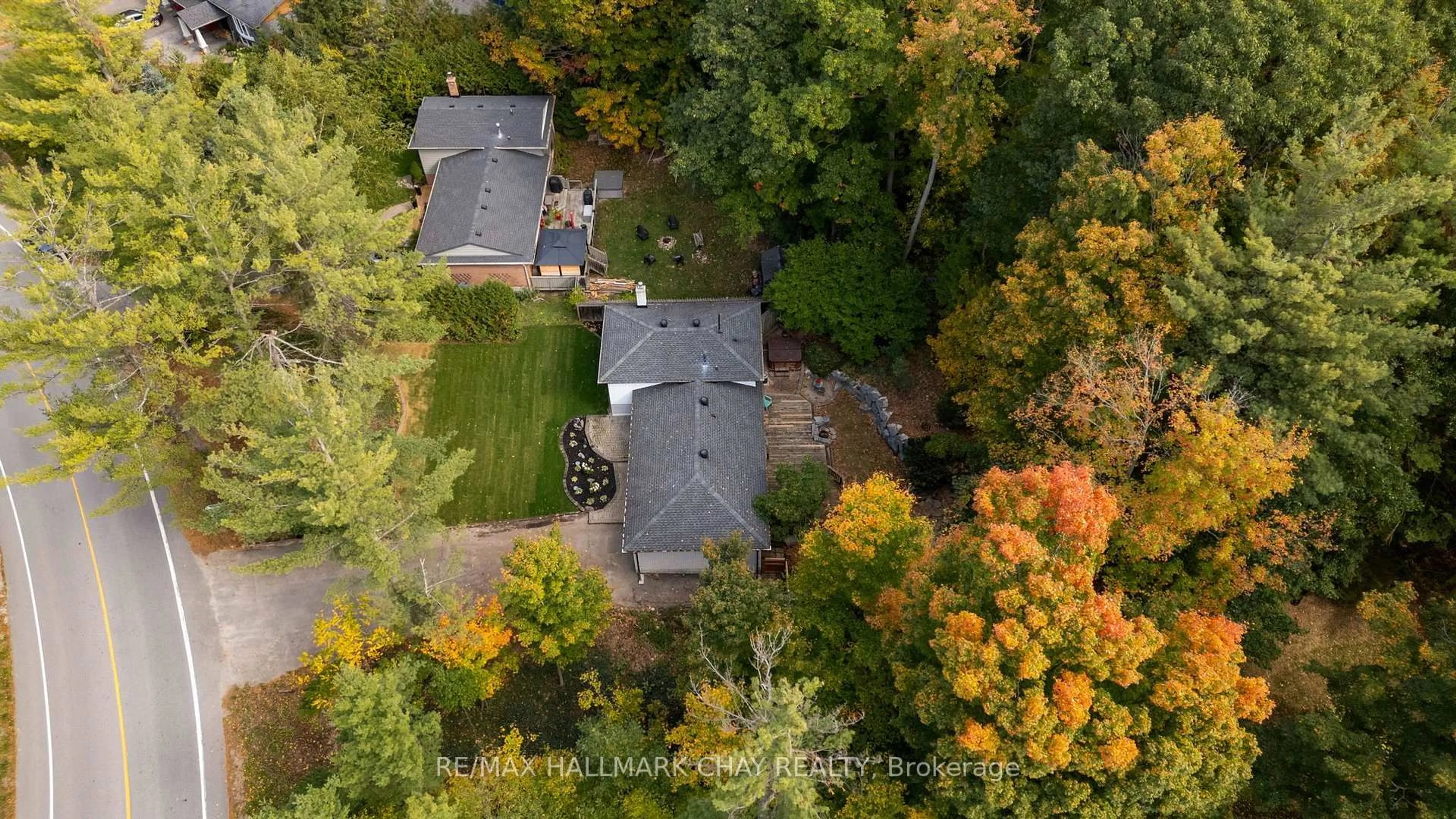 A pic from outside/outdoor area/front of a property/back of a property/a pic from drone, forest/trees view for 53 Doran Rd, Springwater Ontario L0L 1X0