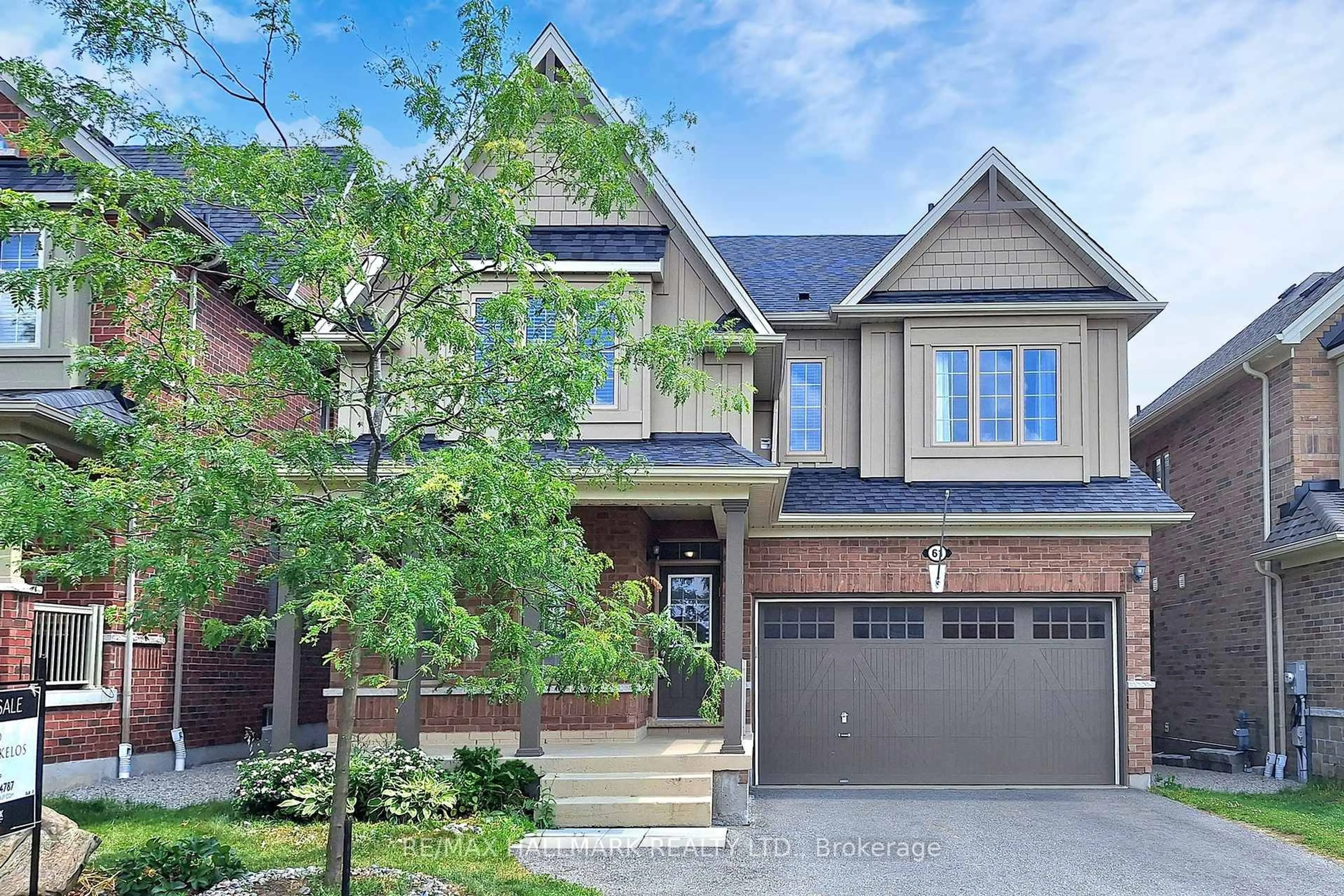 Home with brick exterior material, street for 61 McIsaac Dr, Springwater Ontario L4M 4S4