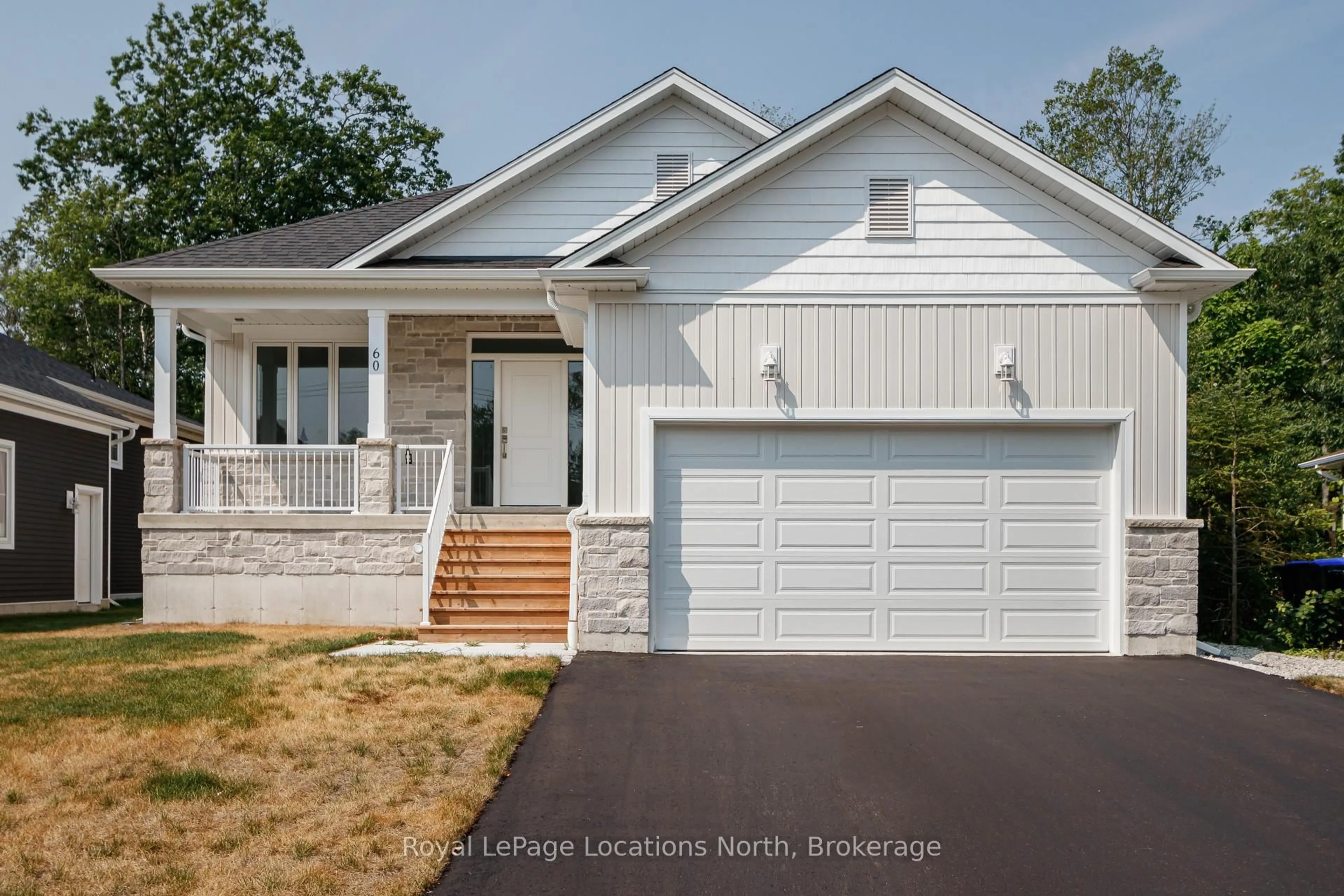 Home with vinyl exterior material, street for 60 52nd St, Wasaga Beach Ontario L0M 1P0